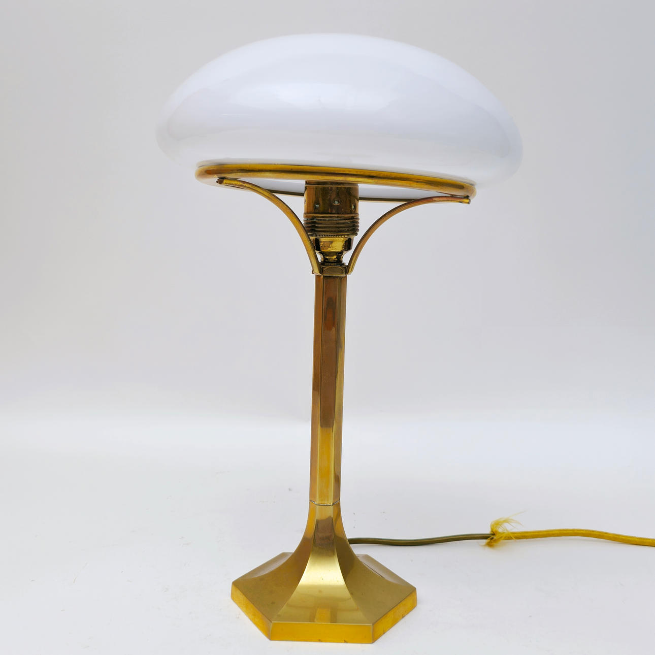 JOSEF HOFFMANN. Attributed to. TABLE LAMP. JUGENDSTIL STYLE. OPAL GLASS SCREEN. GOLD-PLATED BRASS.