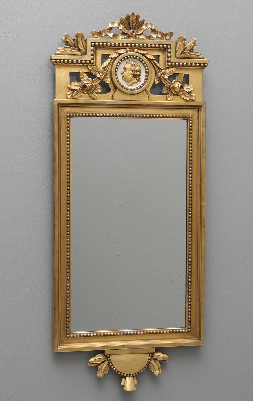 A 20th century Gustavian style gilt mirror.