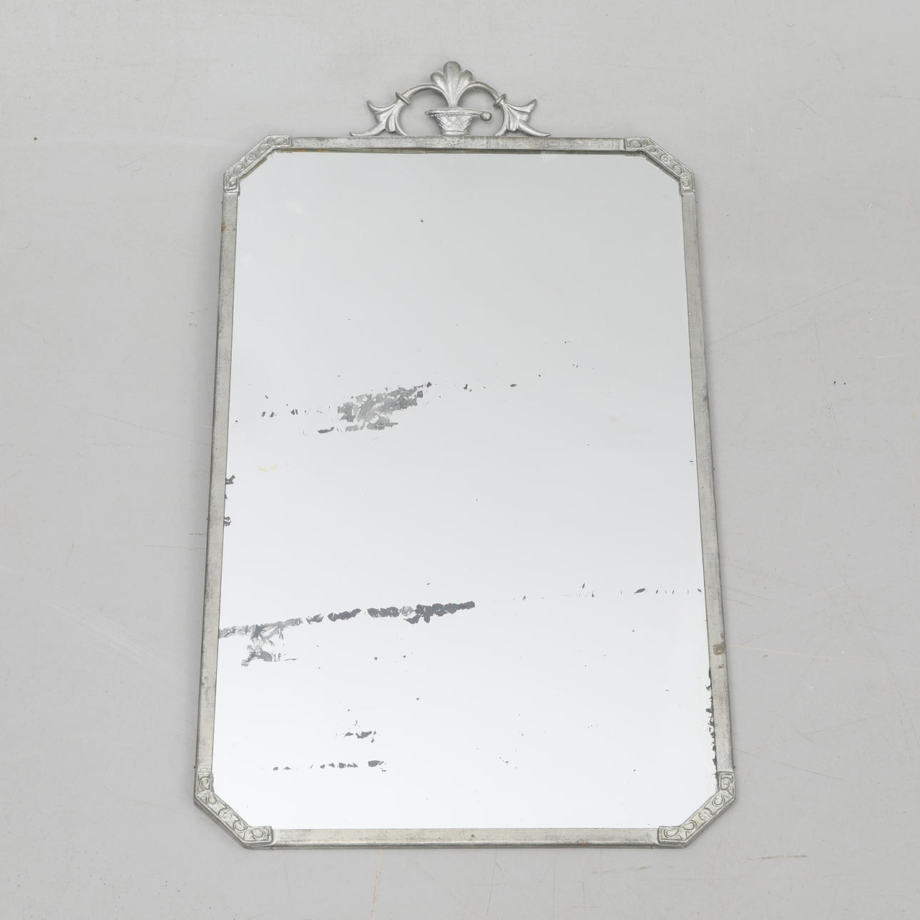 A PEWTER FRAME MIRROR, first half of the 20th century.