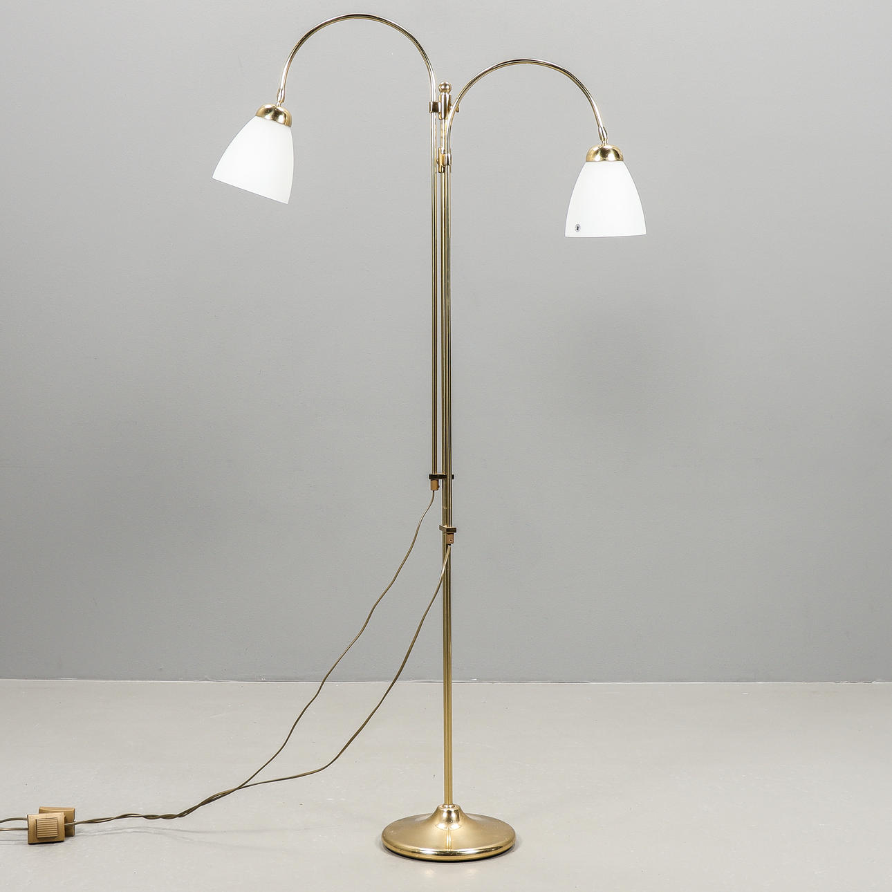 A brass floor lamp, Late 20th century.