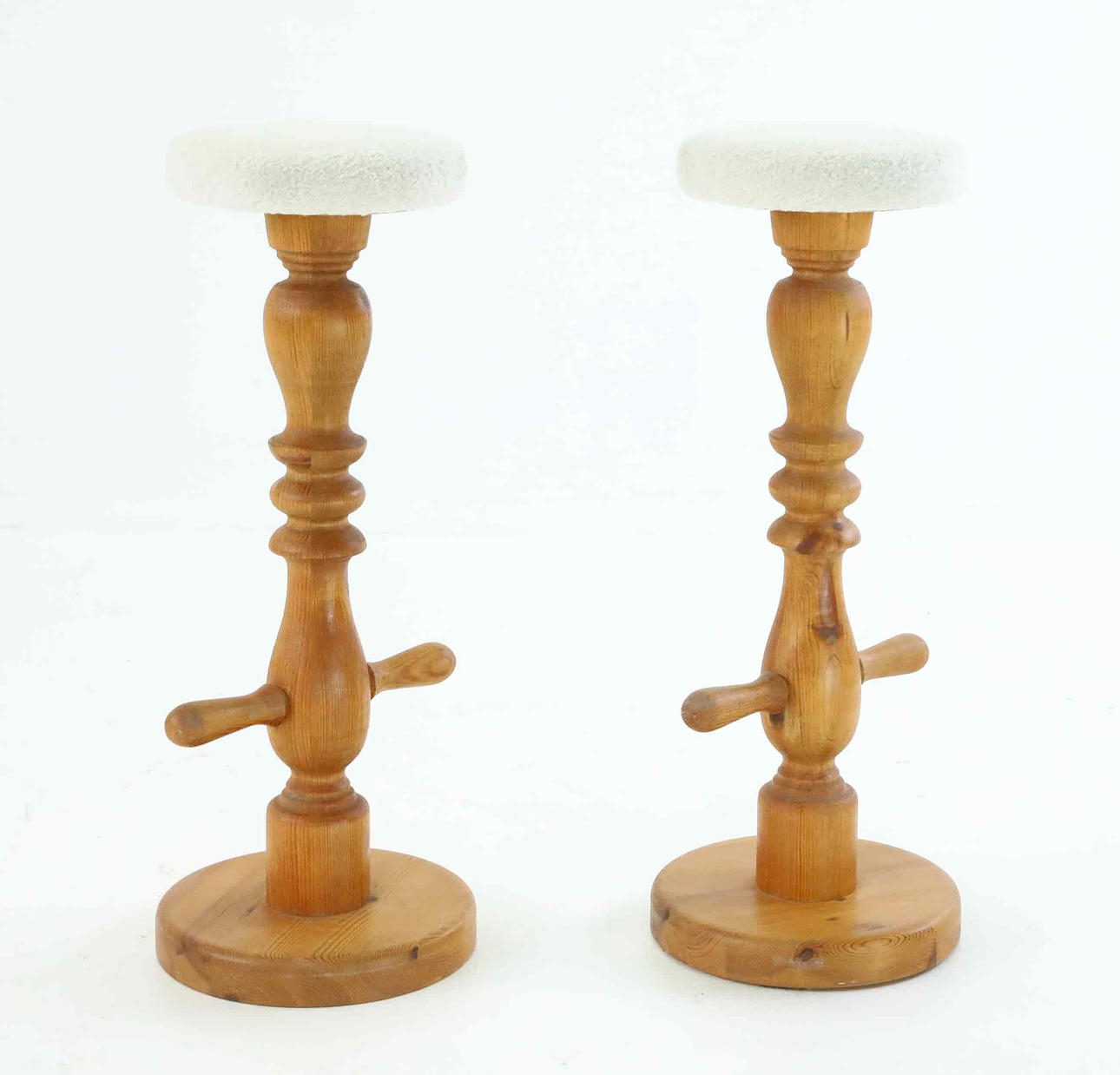 A pair of 1970s solid pine barstools.