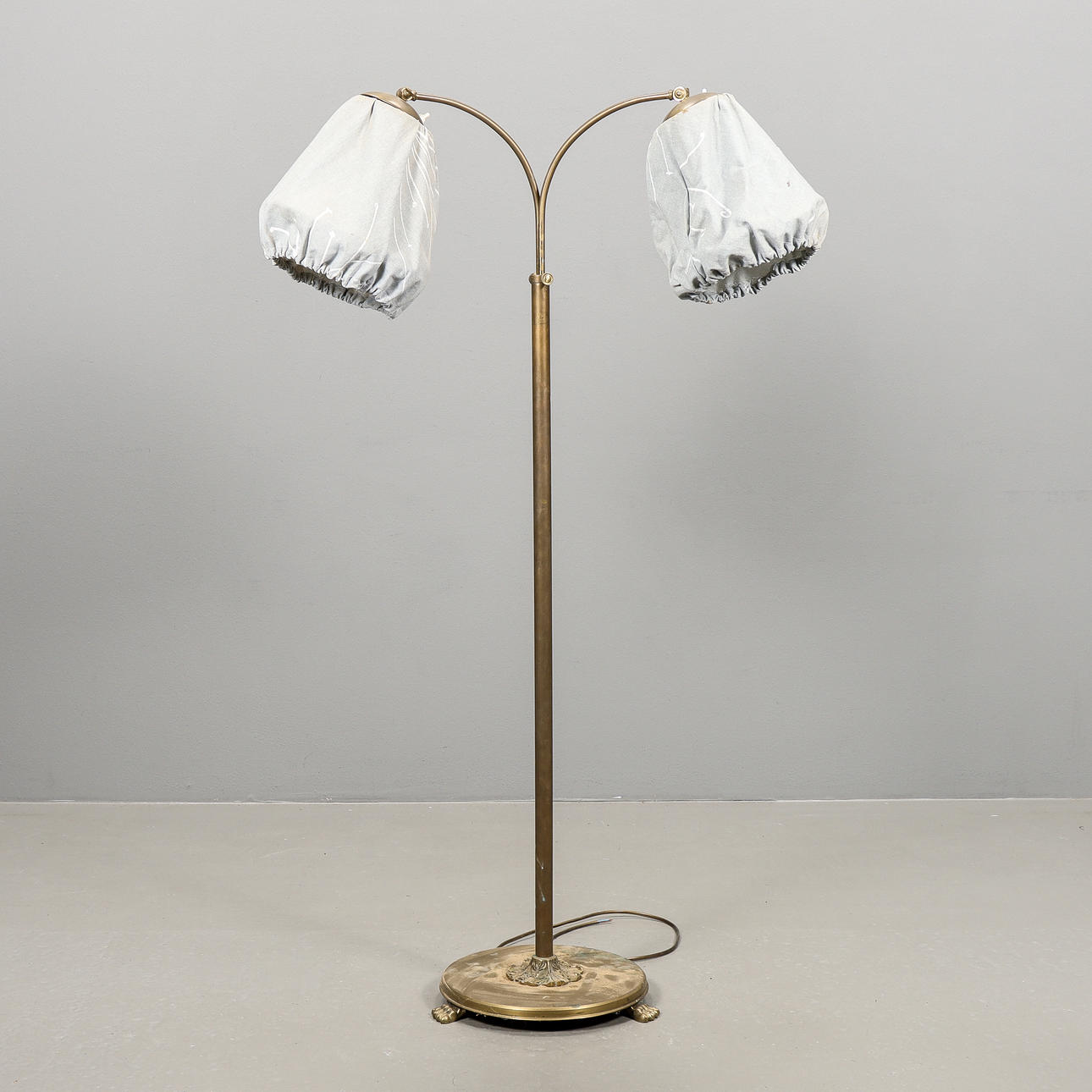 A brass floor lamp, mid 20th century.