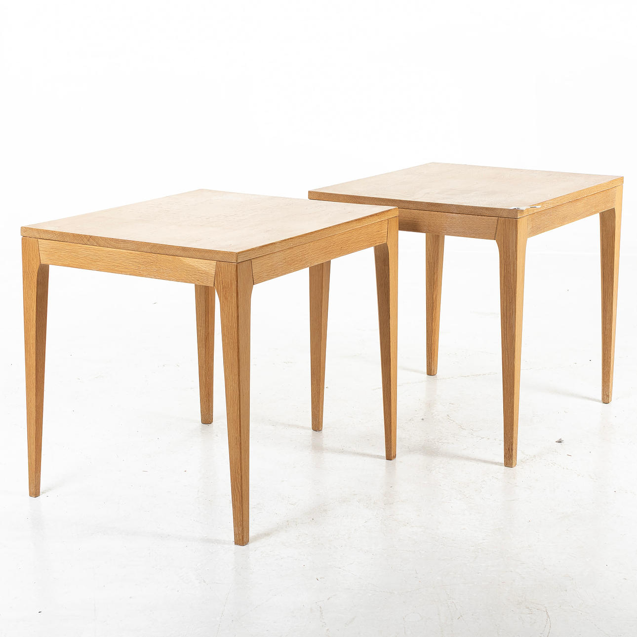 A pair of 1960s oak side tables.