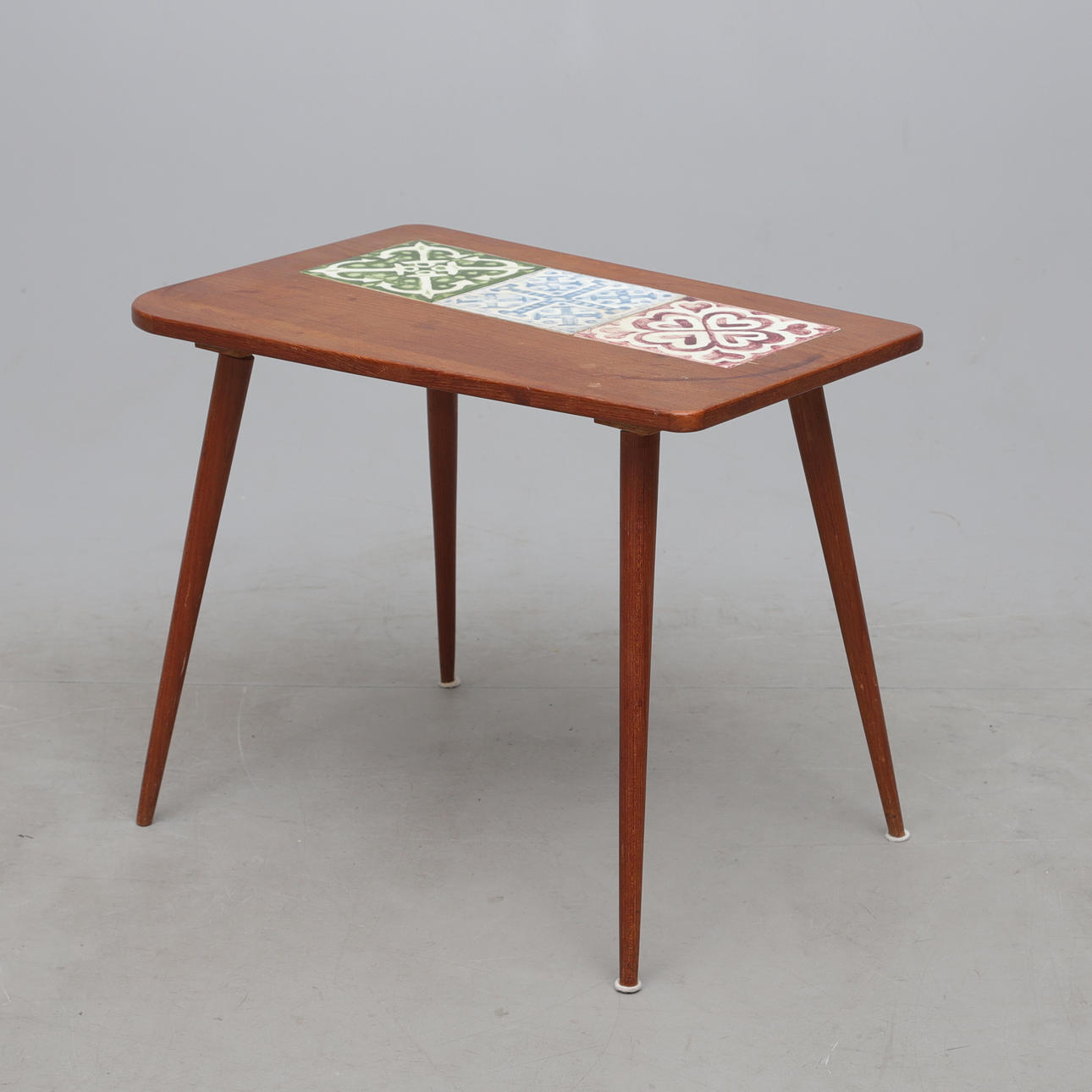 A 1950's teak/tile table.