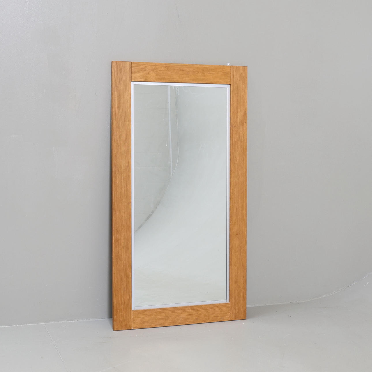 A 20th century oak mirror.
