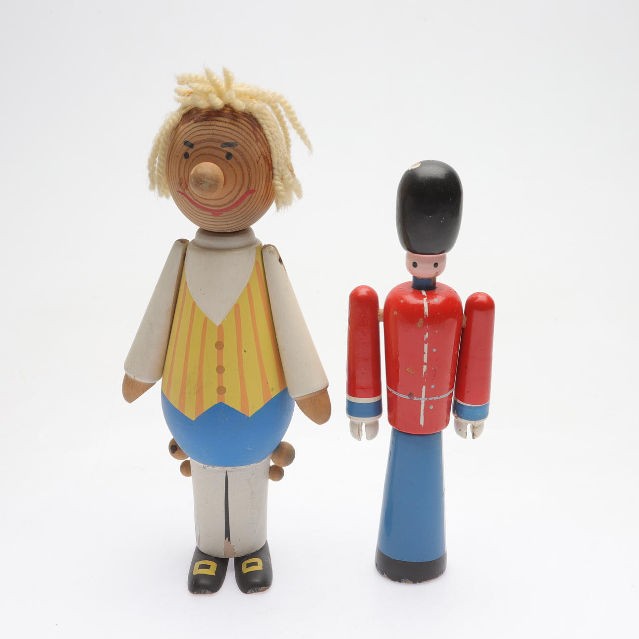 Two painted wood figurines, unsigned, 20th century.