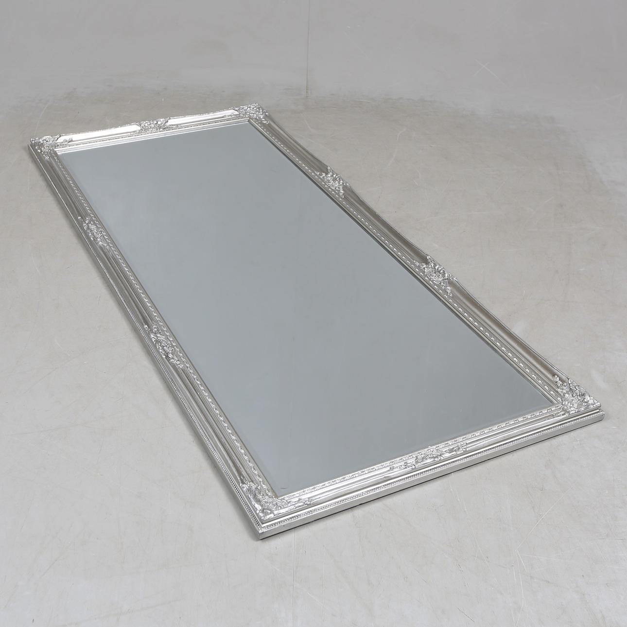 A rococo style mirror, contemporary.