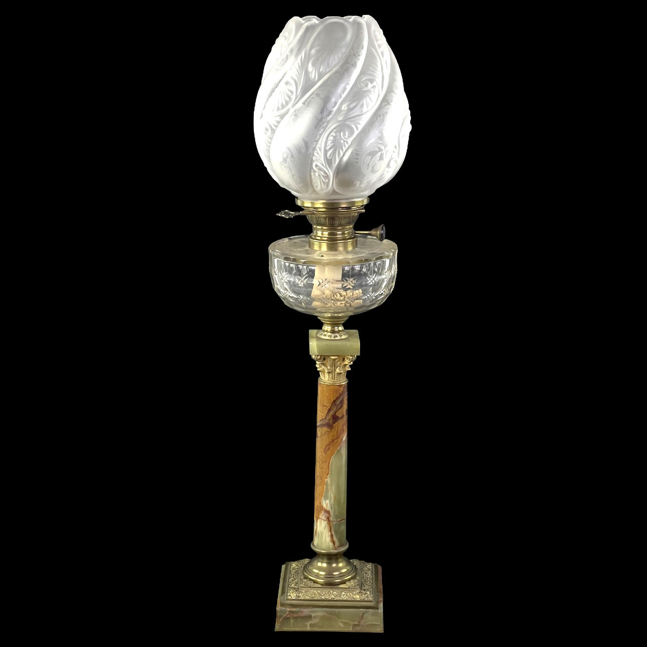 TABLE KEROSENE LAMP. Brass and stone, with tulip cup, 20th century.