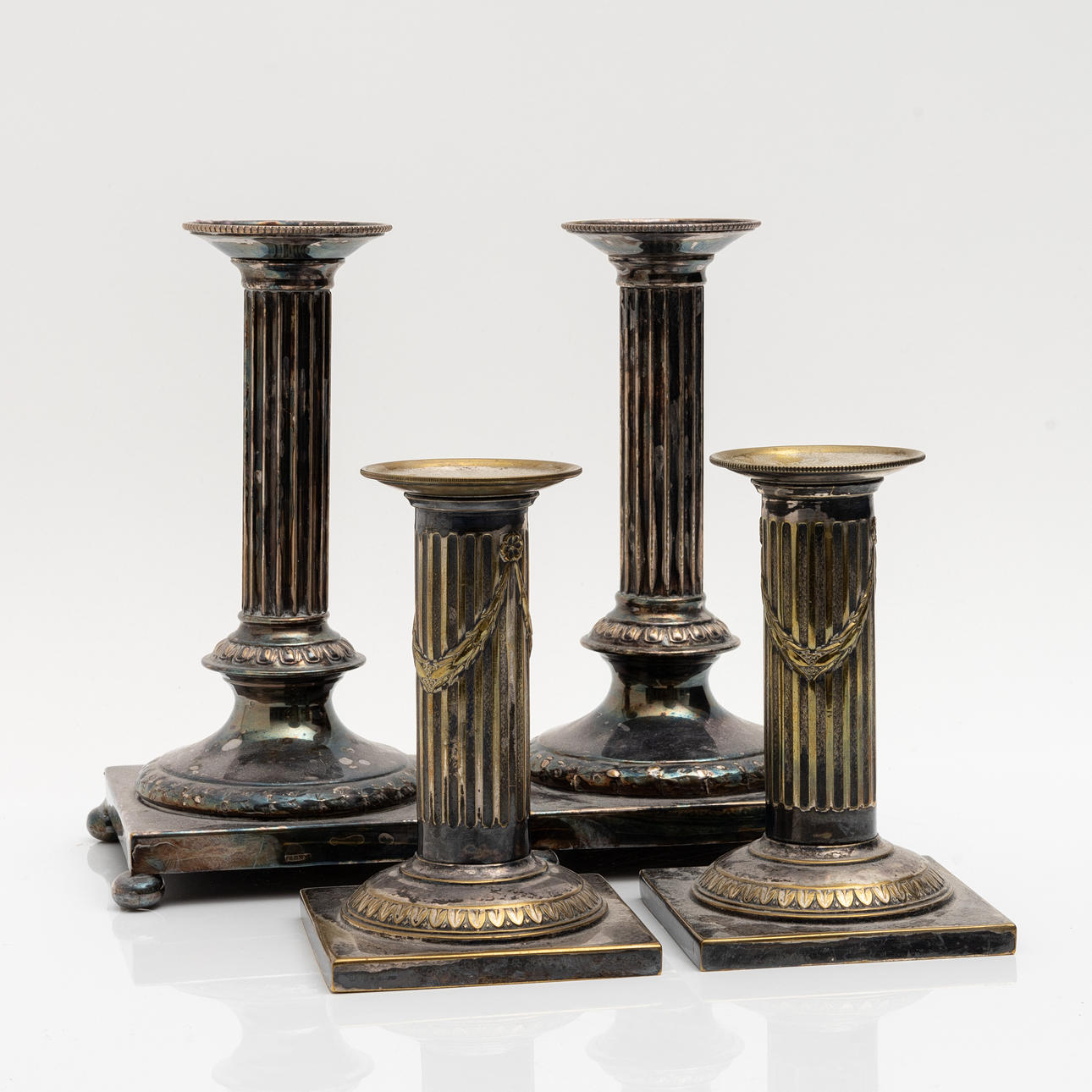 A pair of two column candlesticks, nickel silver, circa 1900.