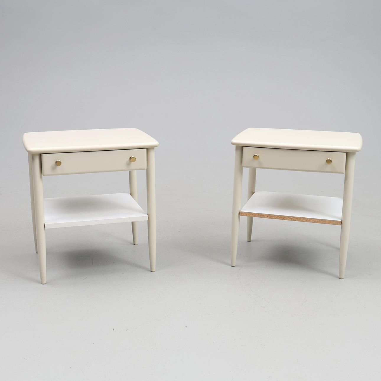 BEDSIDE TABLES. A pair, painted wood.