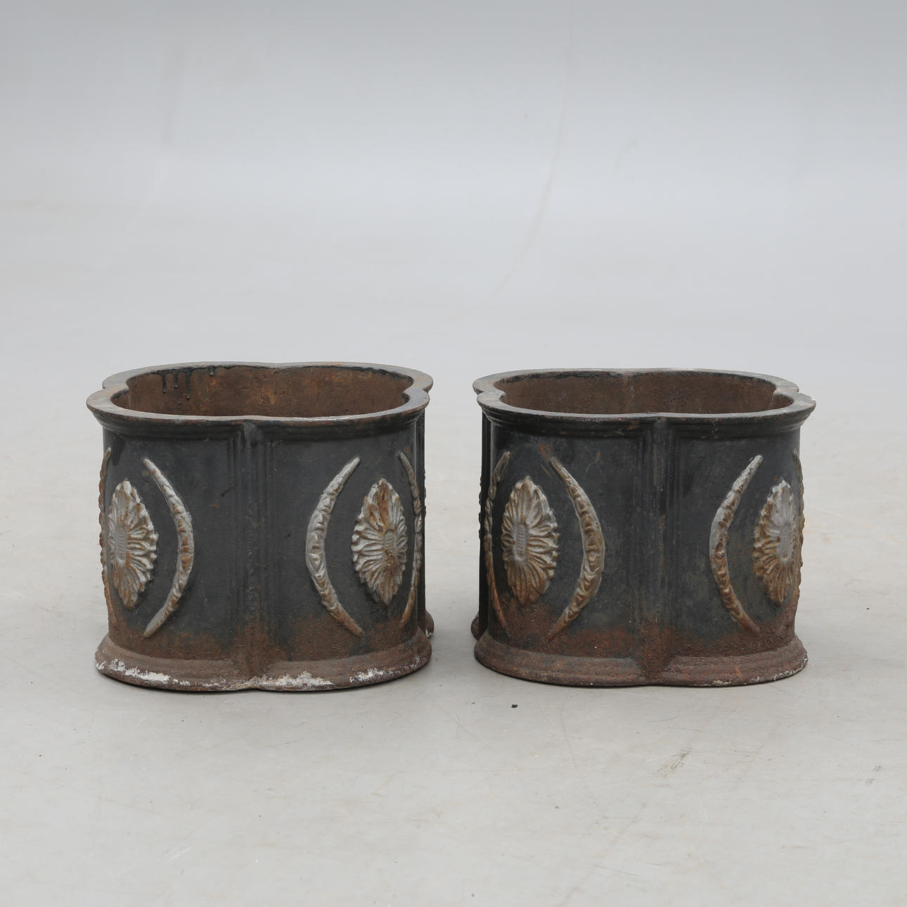 GARDEN URNS, cast iron, a pair.