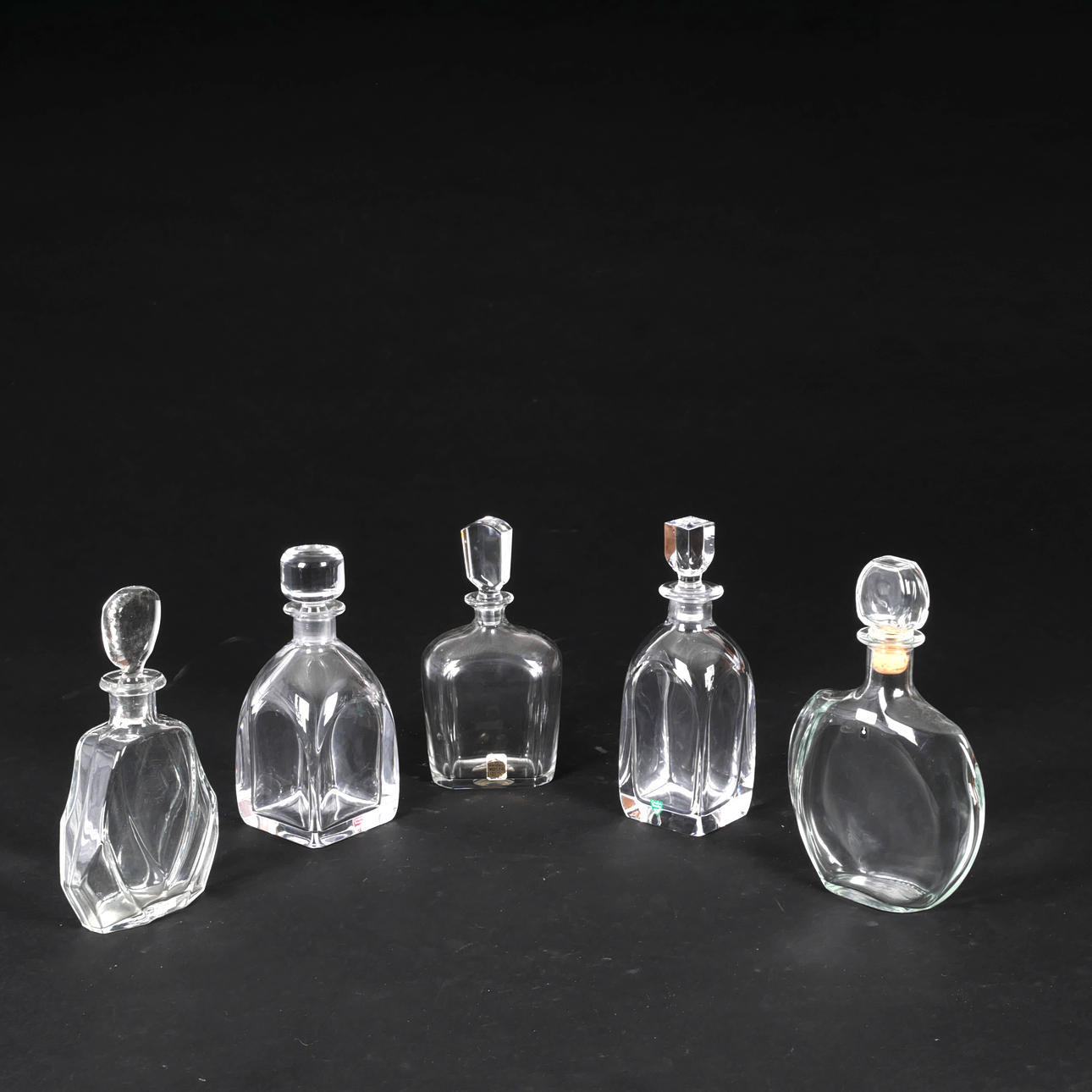 5 decanters, blue Kosta and Orrefors.