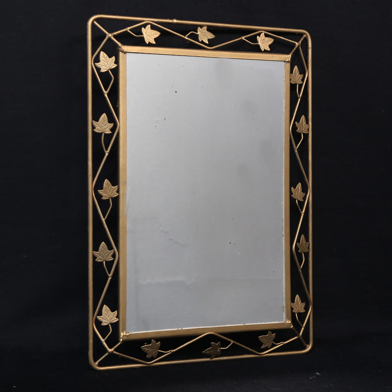 A Swedish Modern mirror, bronzed metal.