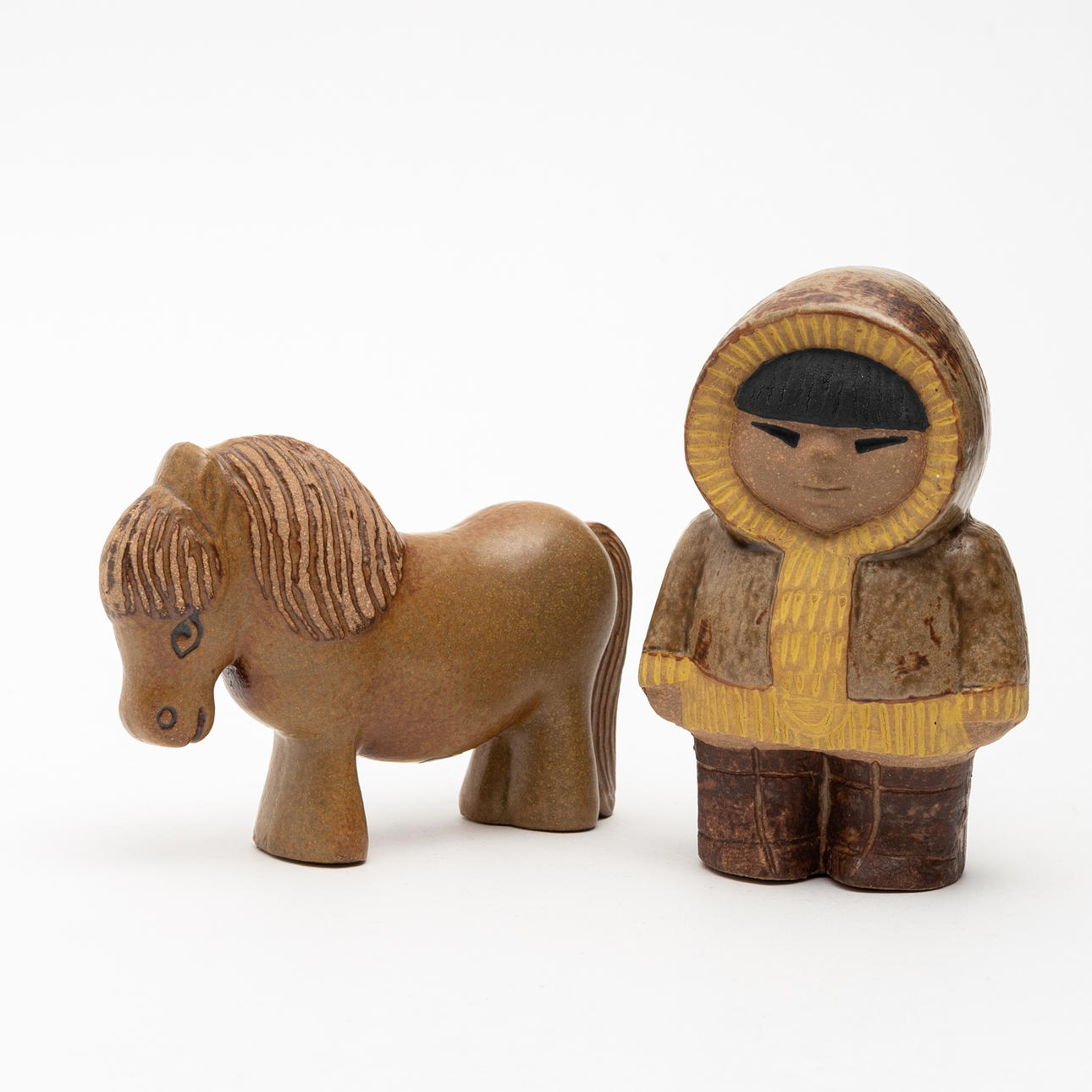 LISA LARSON. Figure, “Nord”, from the series Children of the World, and “Pony”, from Lill-Skansen, stoneware, Gustavsberg.