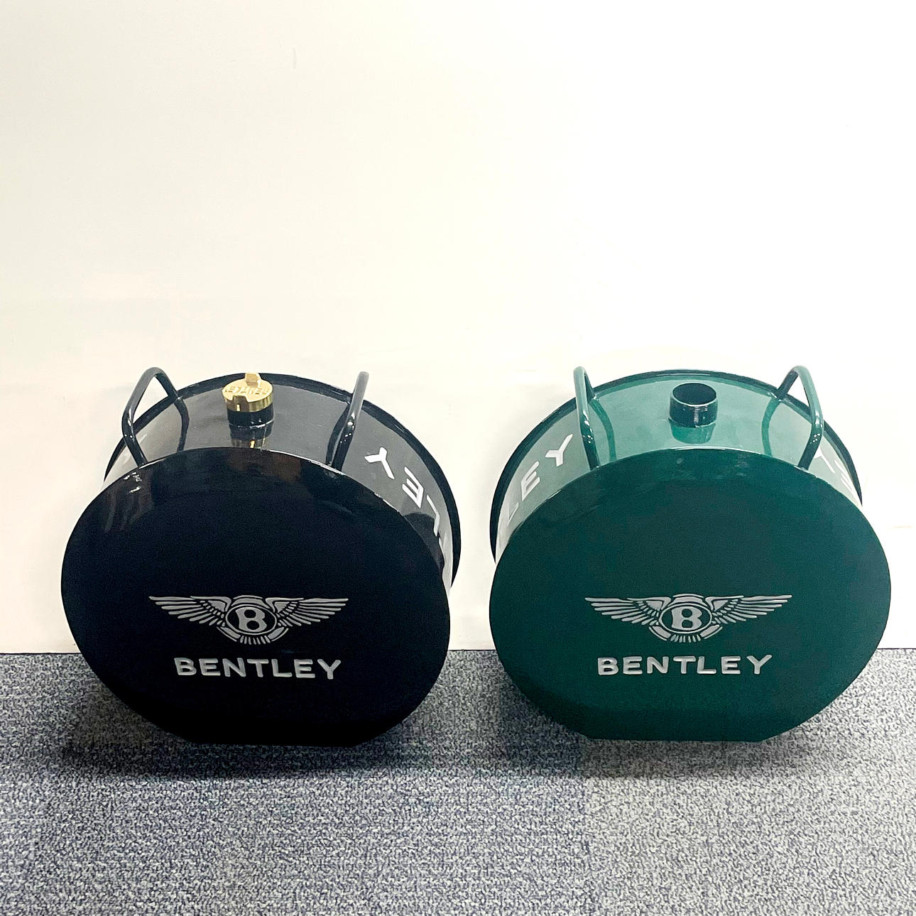 TWO ADVERTISING CANS.