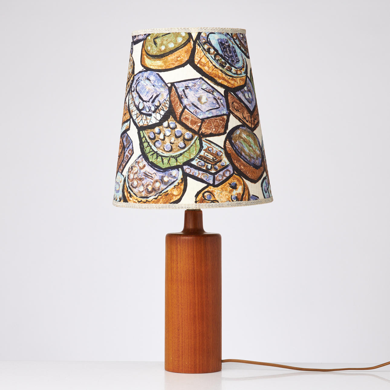 TABLE LAMP. Teak, 1960s, painted textile screen.