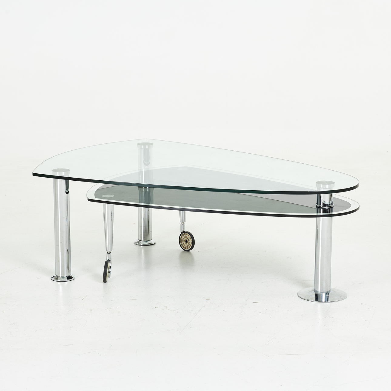 A late 20th century coffee table, double disc glass table.