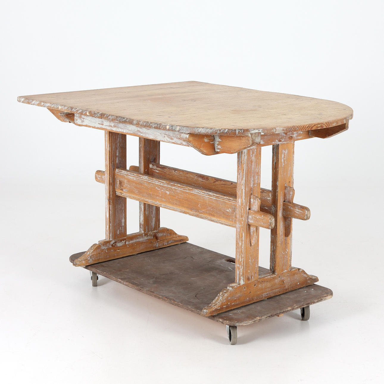 A wooden trestle table, 19th century.