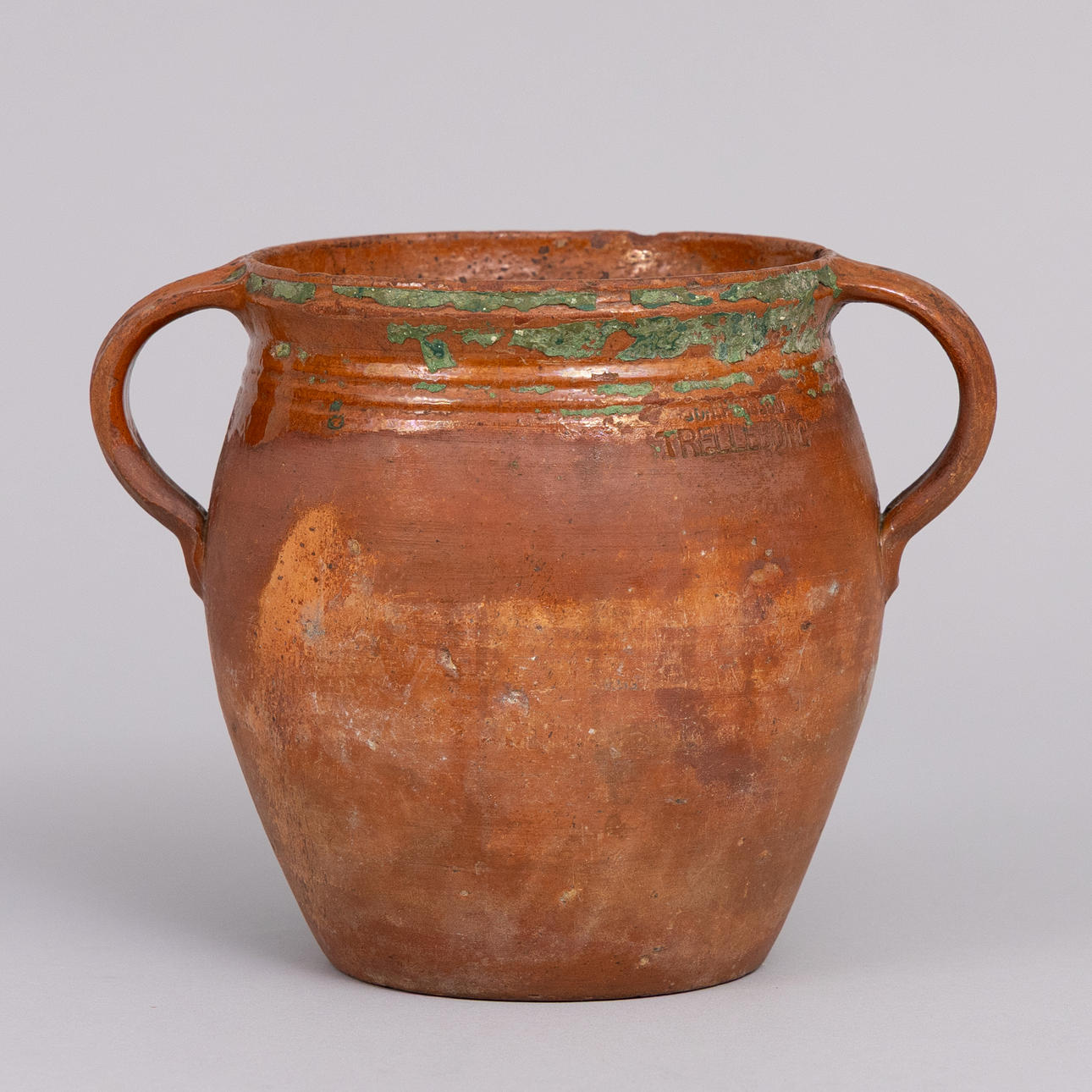 A mug, partly glazed earthenware, marked Trelleborg.