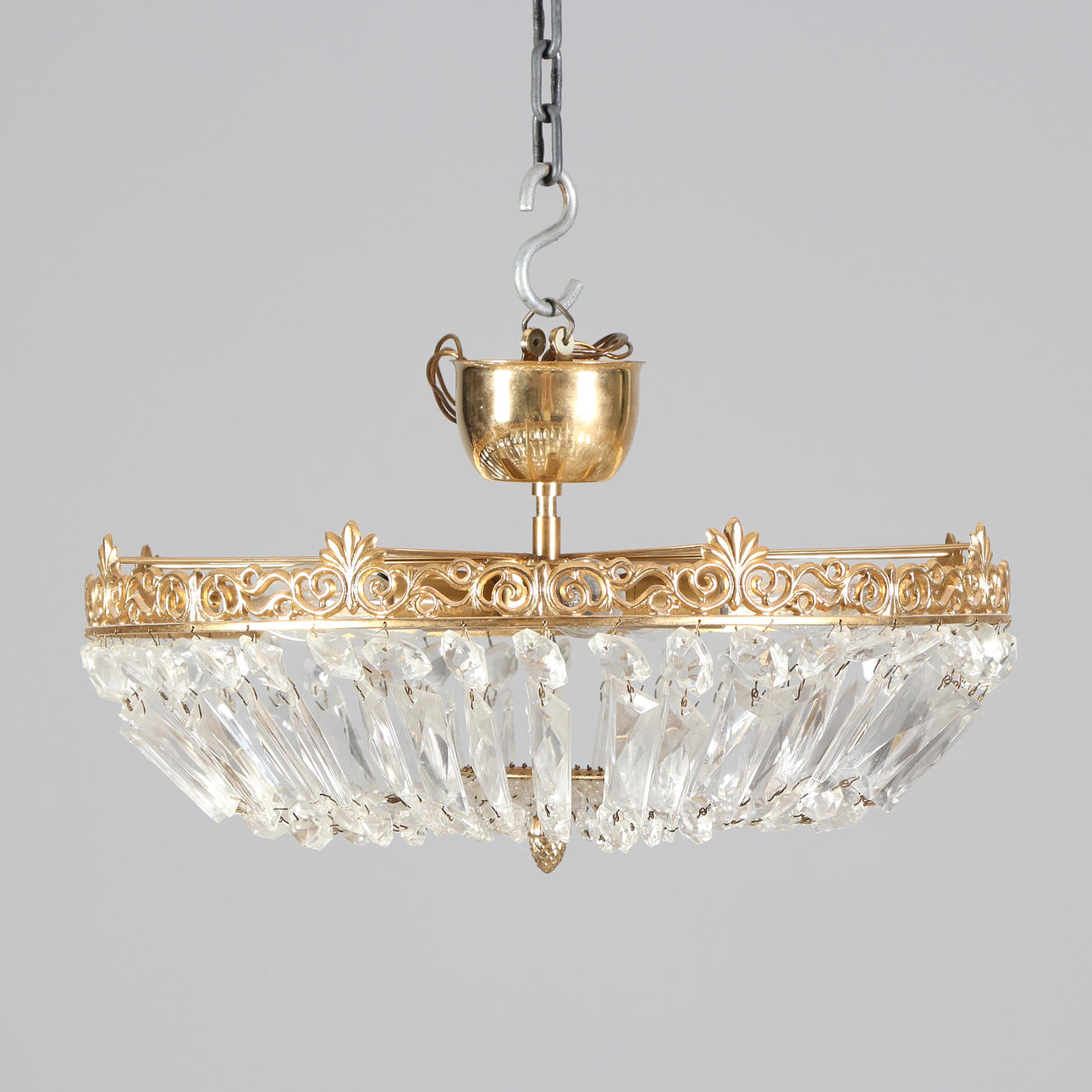 CEILING LAMP WITH PRISMS. Gilded metal with glass prisms. Second half of the 20th century.