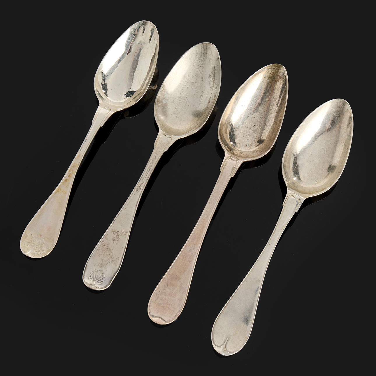 A set of four silver spoons, first half of the 19th century, different models, including Gustav Otto Sjöberg, Petter Adolf Sjöberg.