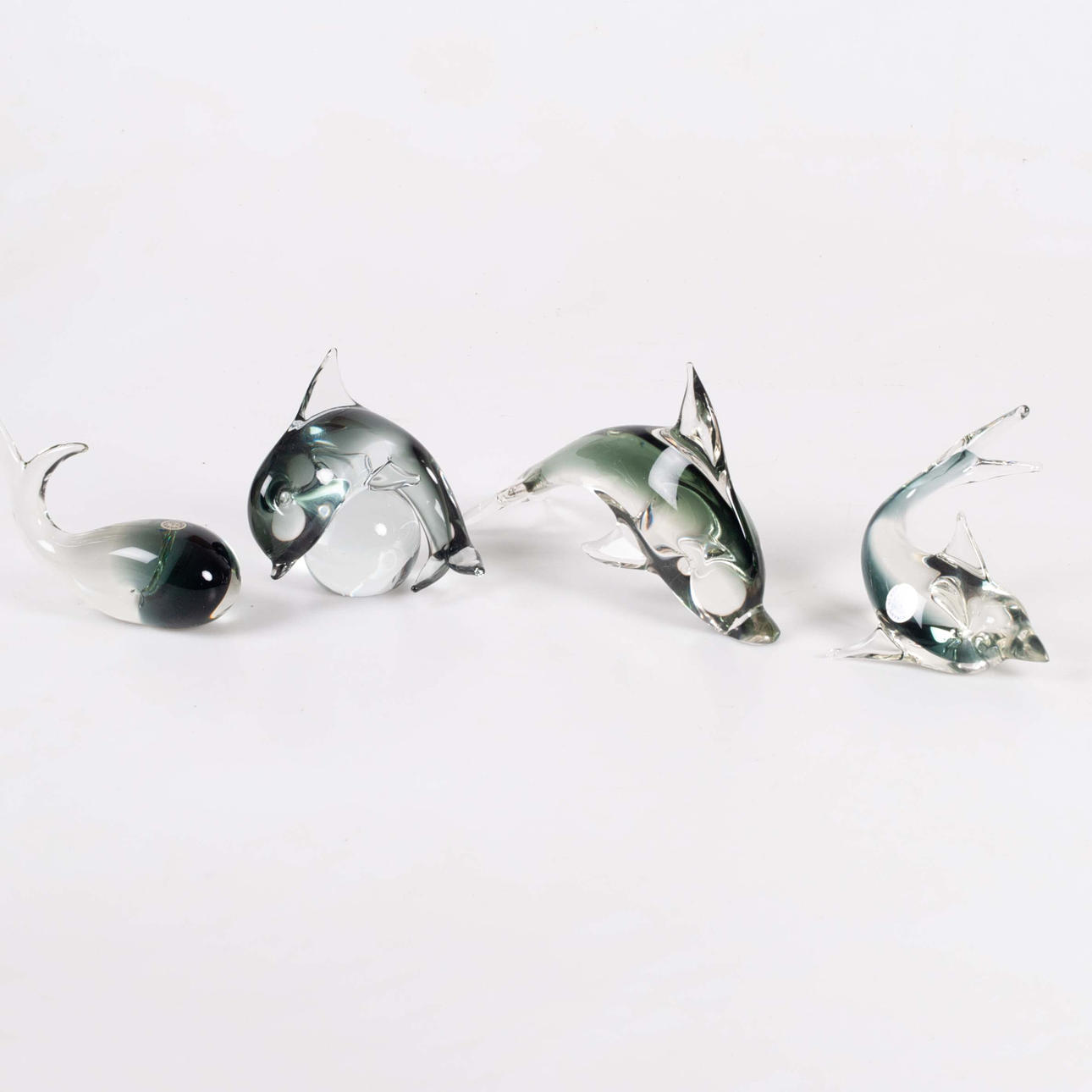 Ein Satz von vier Murano-Glasfiguren.