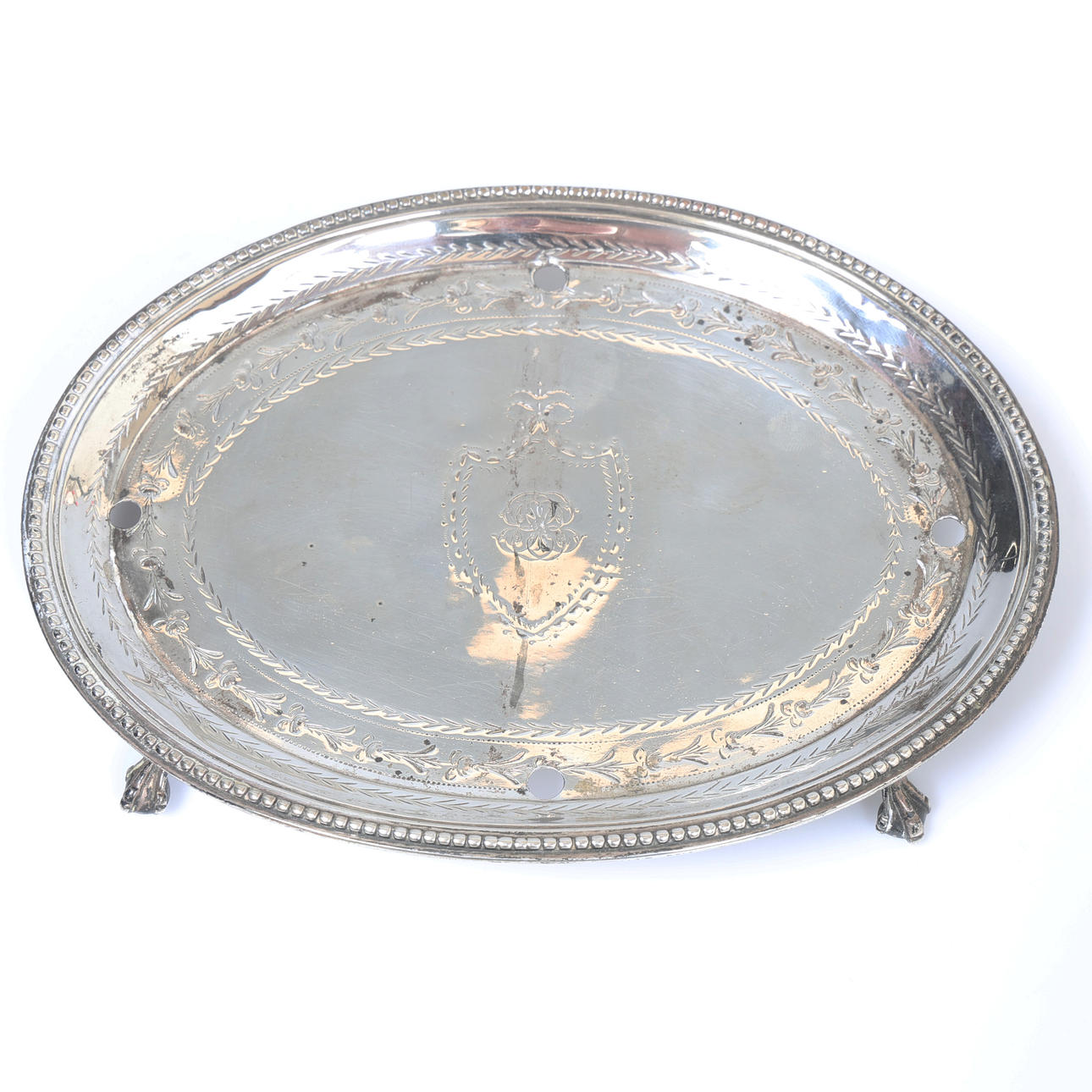 A GEORGE III SILVER TEAPOT STAND.