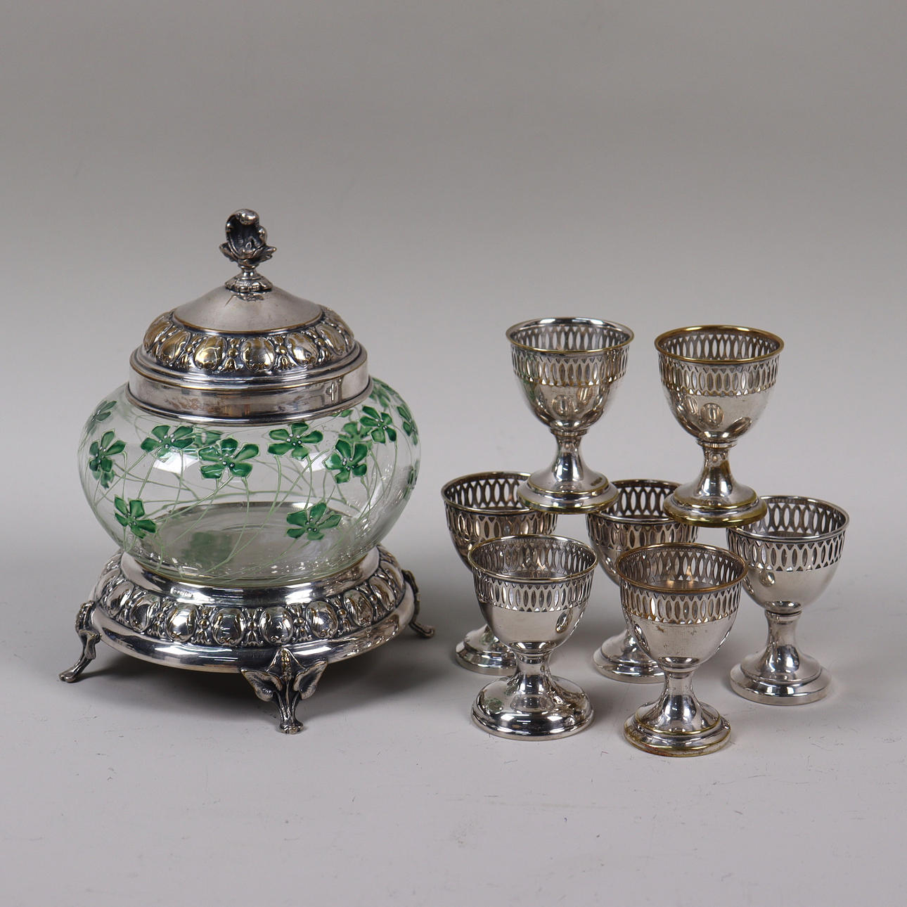 NICKEL SILVER, cucumber jar and egg cups, 8 pieces.