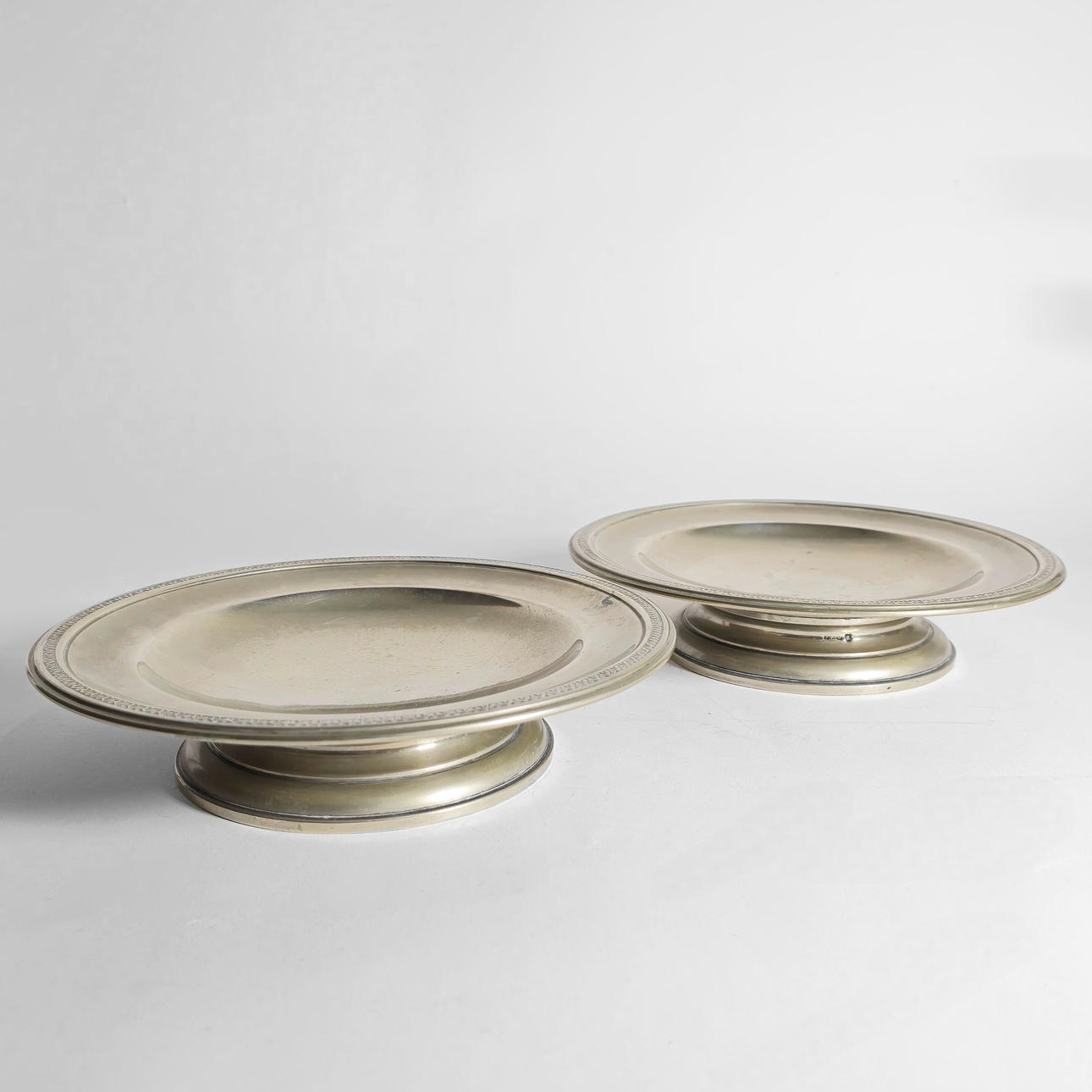 TWO CIRCULAR TRAYS FOR CANDIES. WITH ANAGRAM. SILVER METAL.