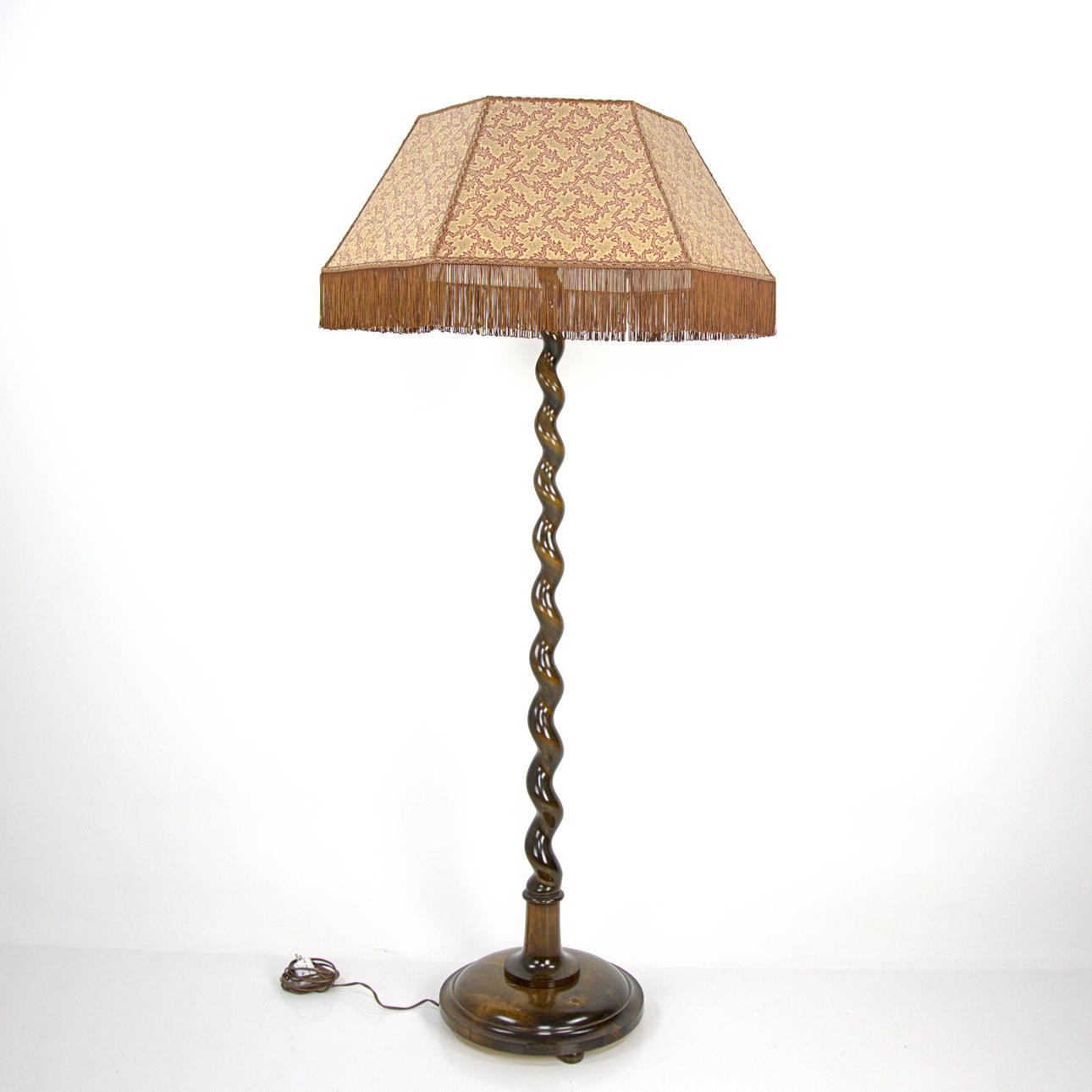 A floor lamp, turned wood, two light points, fabric shade, 1930/40s.