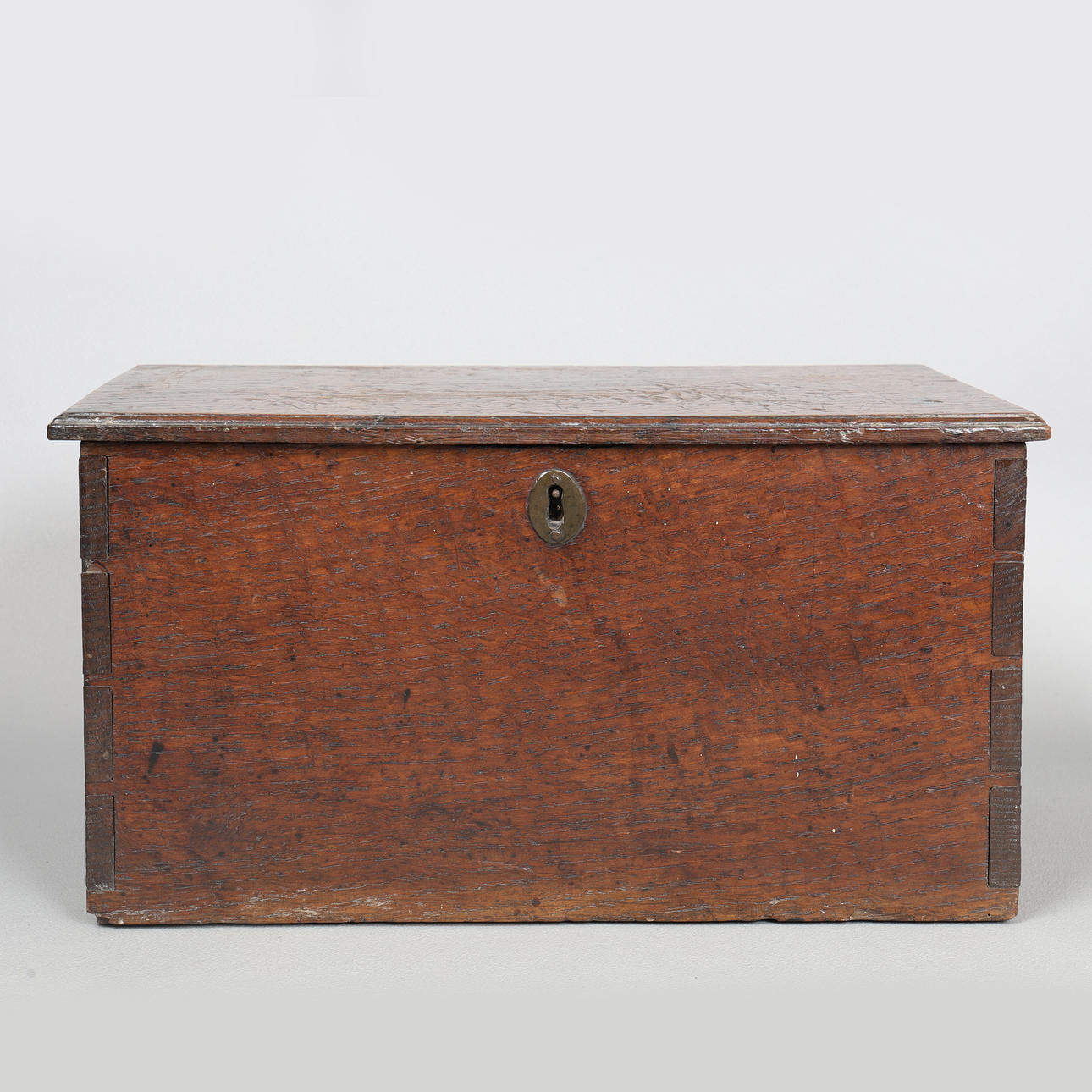 A GEORGE III OAK BOARDED BOX.