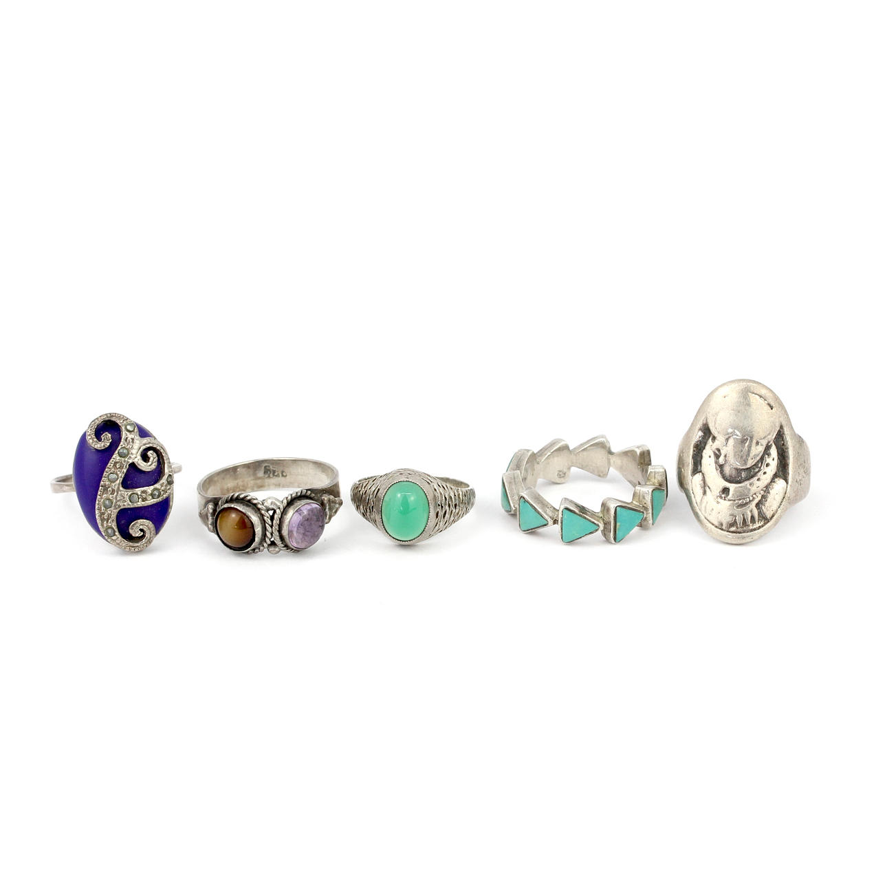 FIVE SILVER STONE SET RINGS.