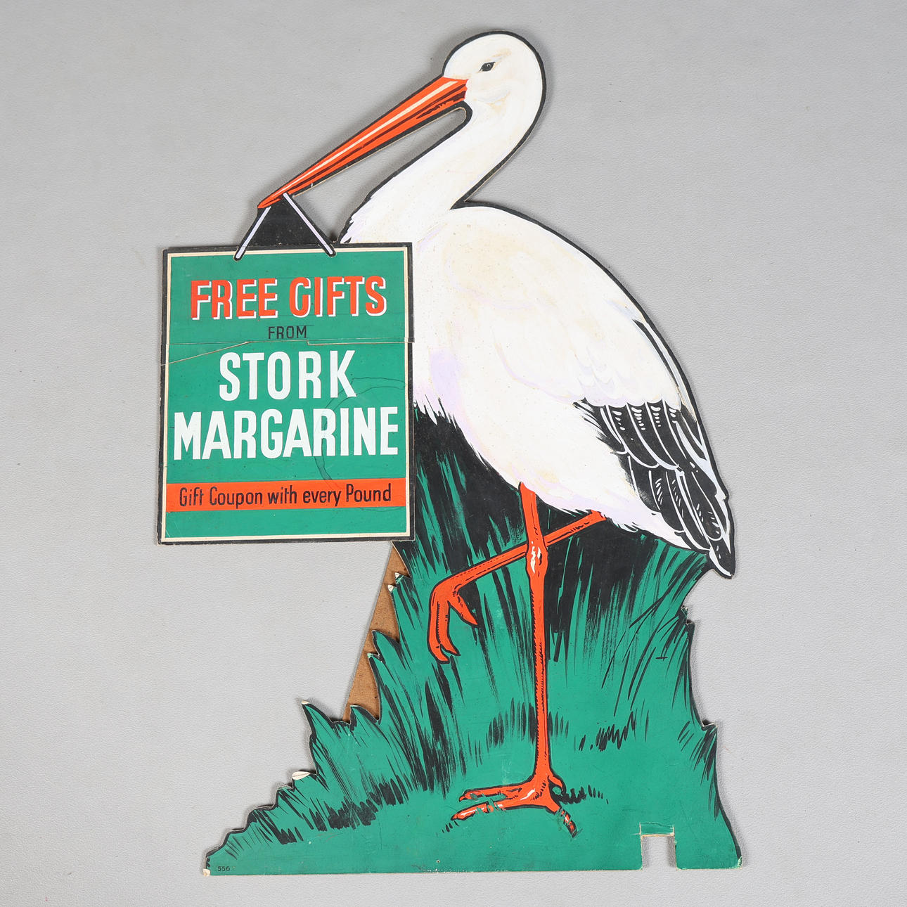 A HAND PAINTED STORK ADVERTISING SIGN.