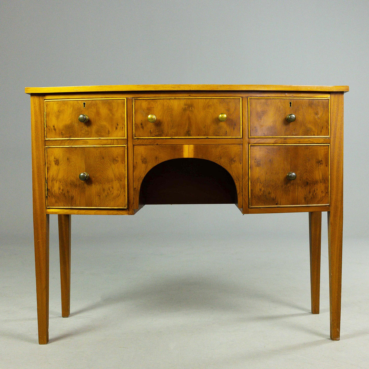 A GEORGIAN STYLE YEWWOOD SIDEBOARD.