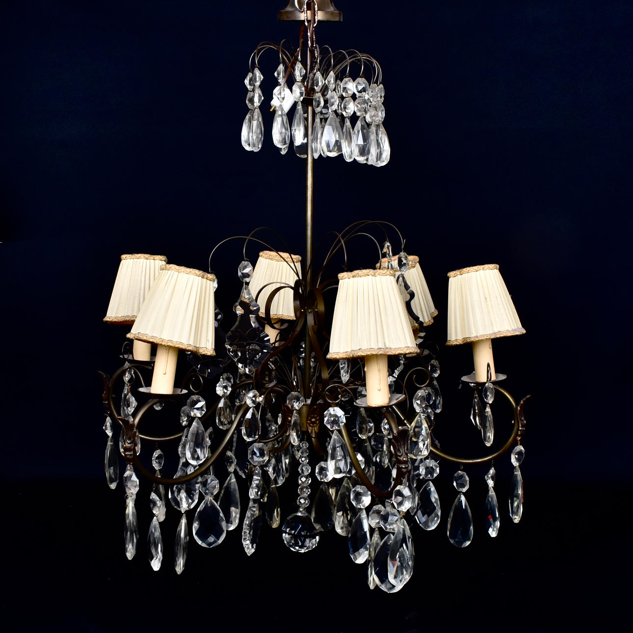 A 20th-century ceiling chandelier with prisms.