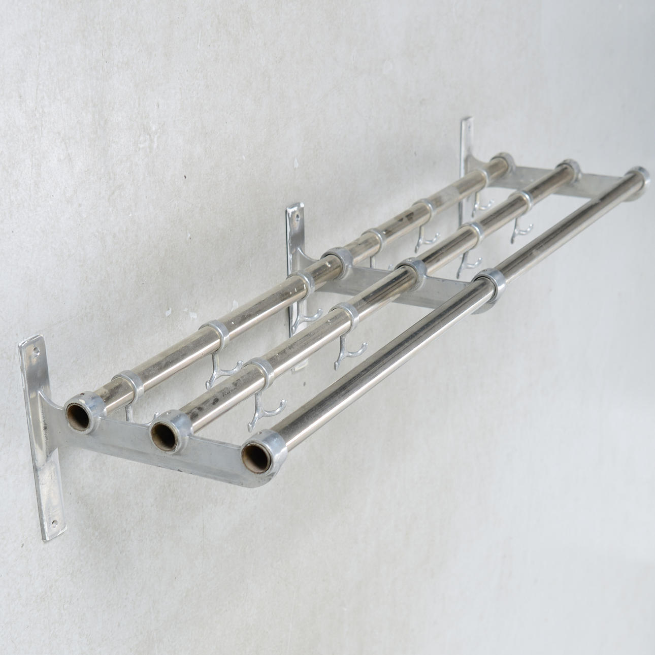 A metal hat shelf, mid 20th century.