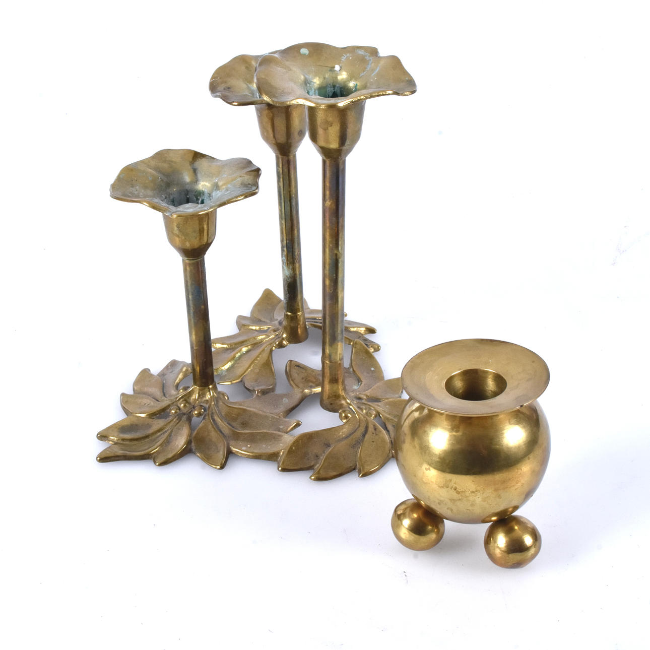 A brass candlestick and candelabra, 20th century.
