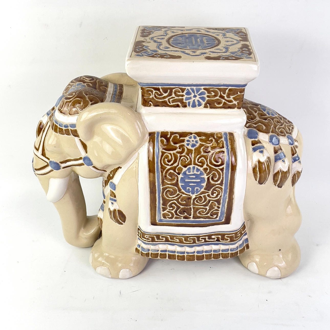 A ceramic pedestal, elephant.