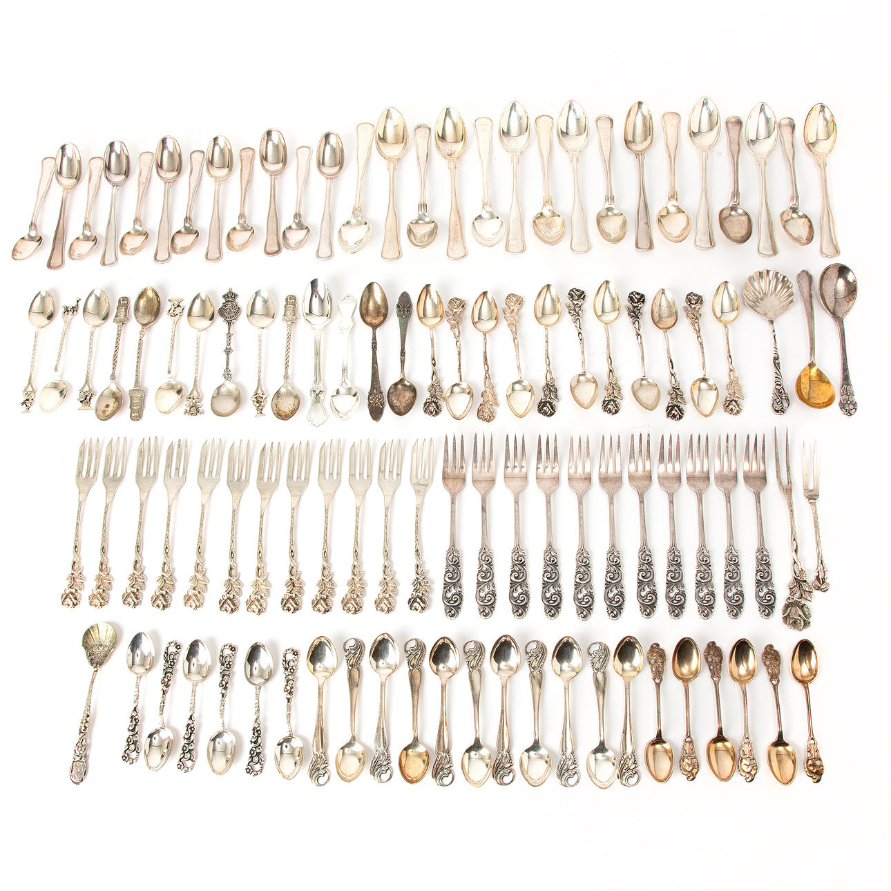 SPOONS AND DESSERT FORKS, 105 pieces, silver.