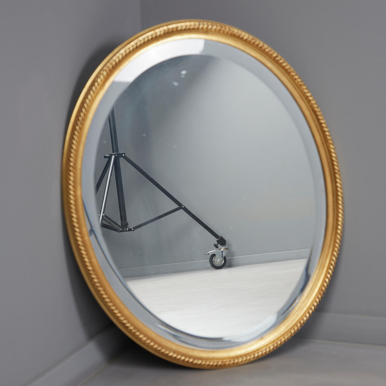 Golden oval mirror/wall mirror.
