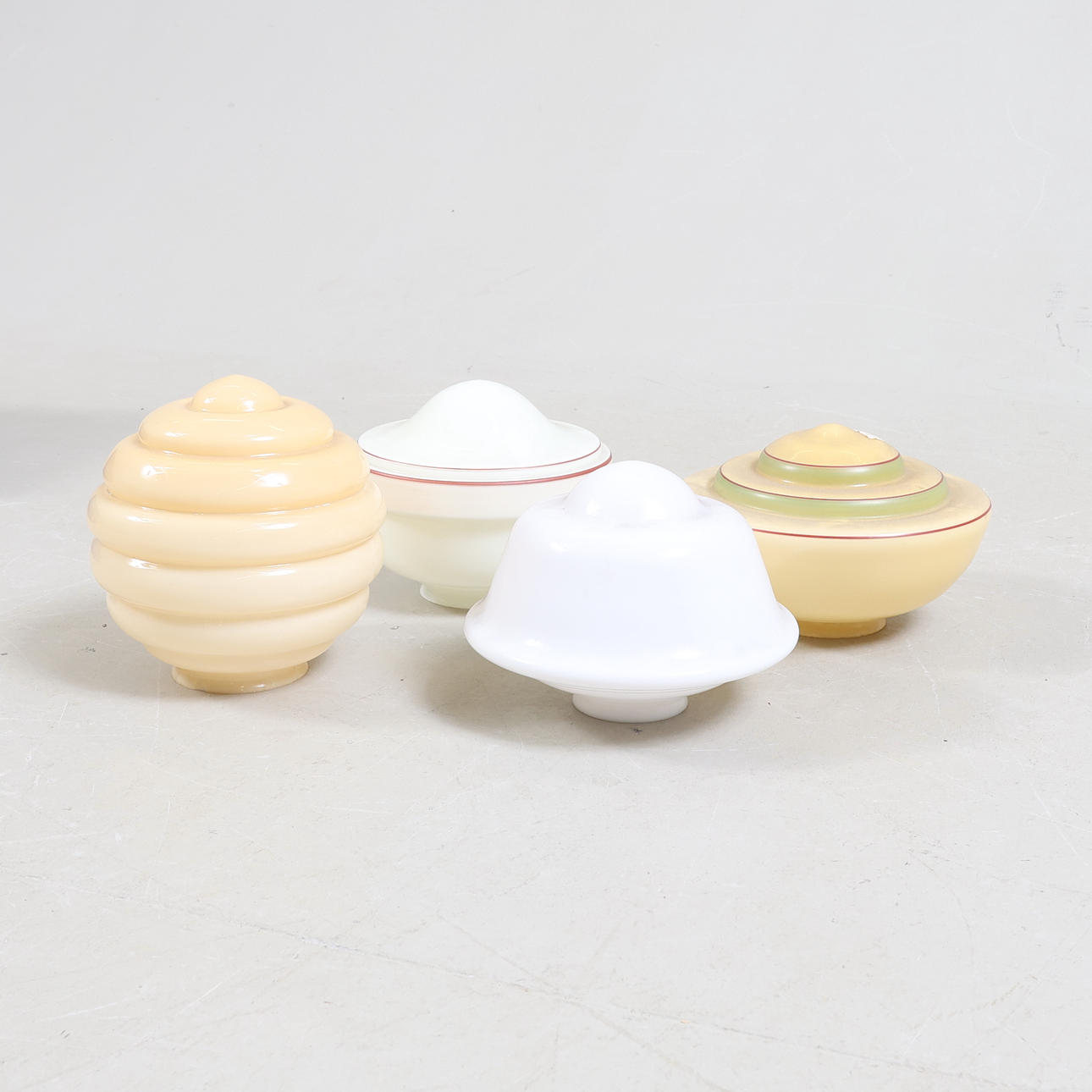 A set of four functional lamp cups, 1930s/40s.