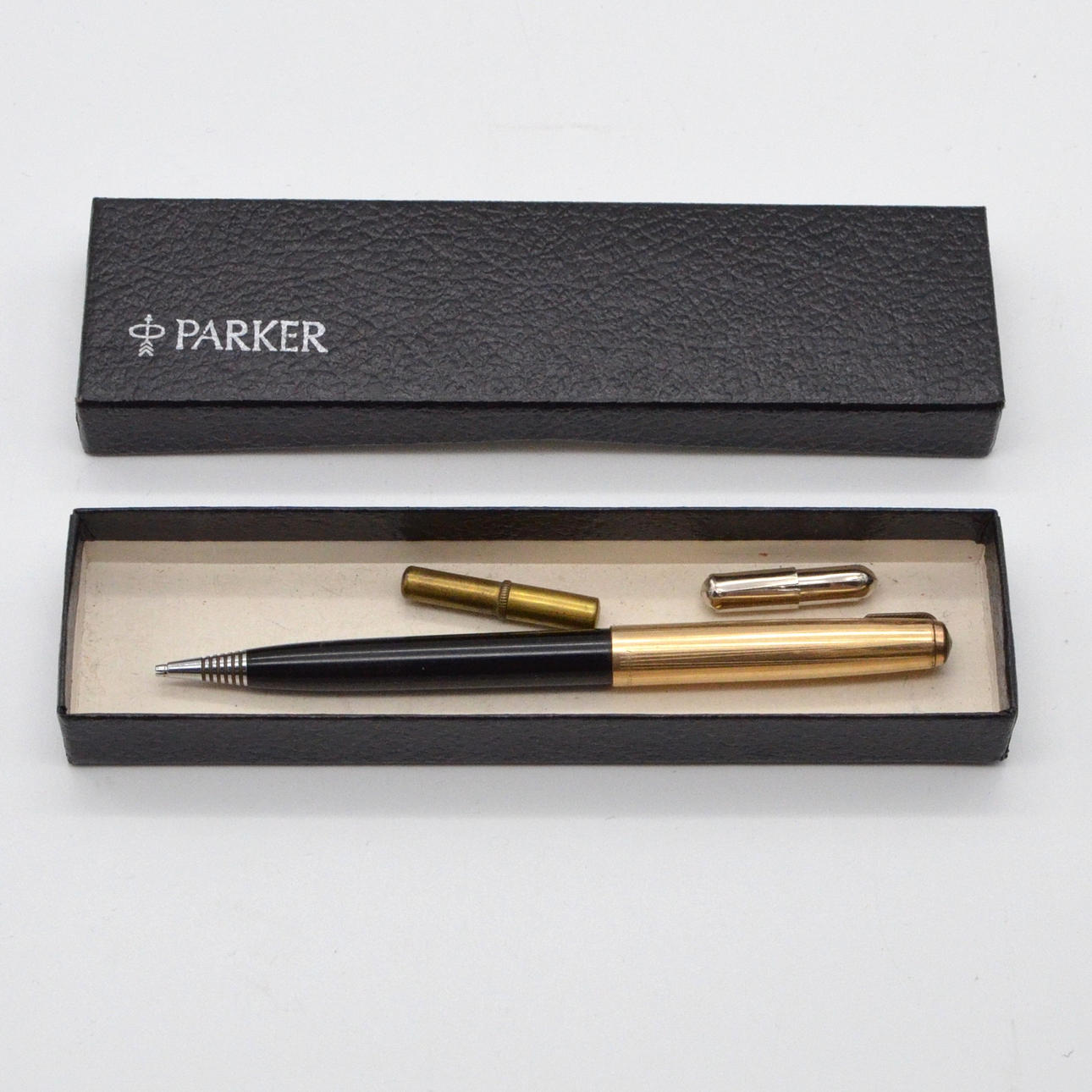 PARKER MECHANICAL PENCIL WITH FACE, PLASTIC CASE WITH 12KT GOLD-PLATED CAP, WITH ORIGINAL BOX.