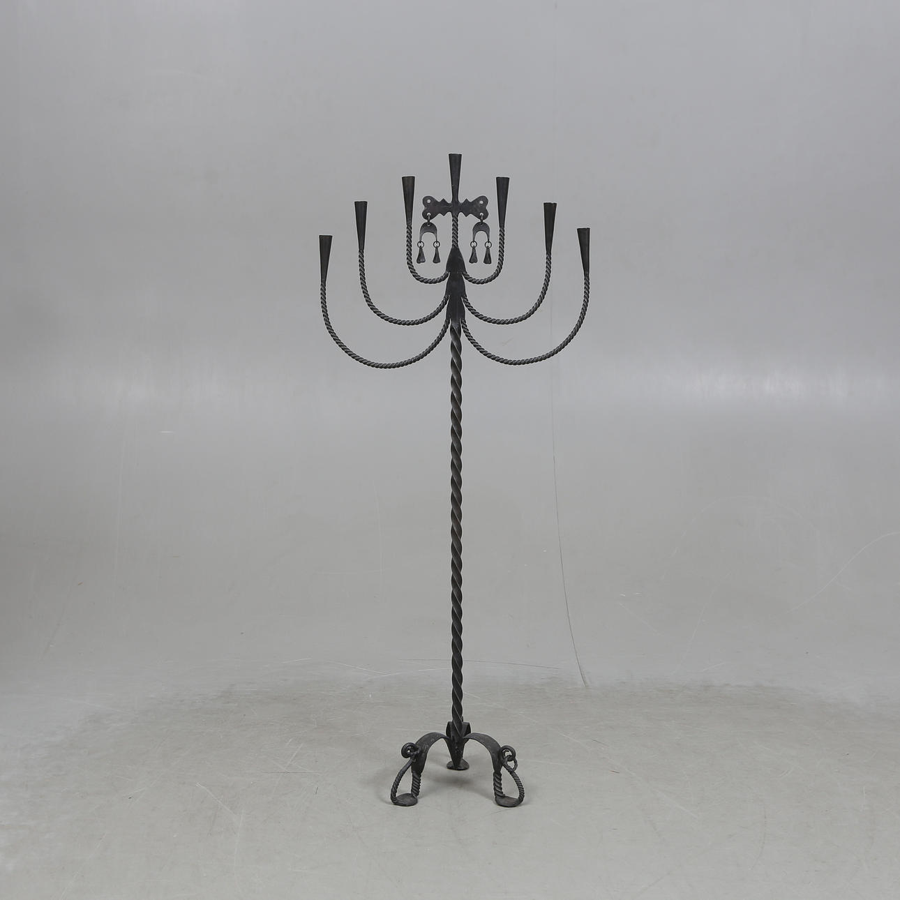 A 20th-century wrought floor candlestick.