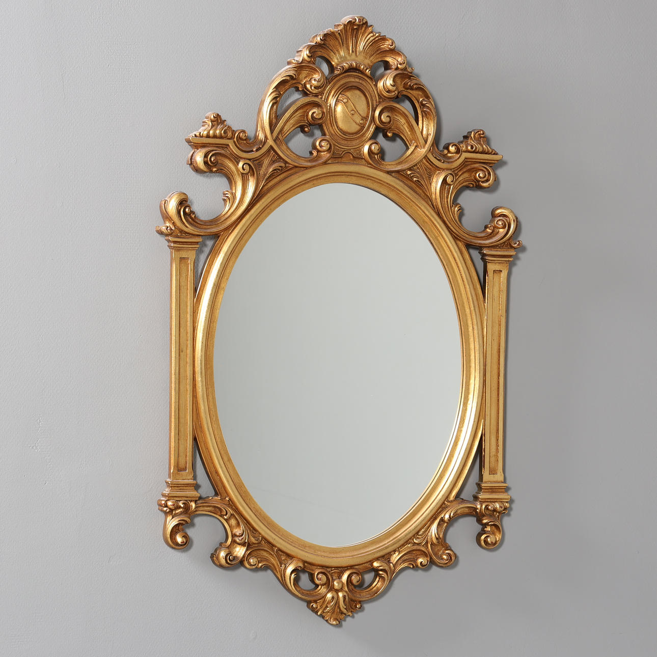 A 20th century rococo style mirror.