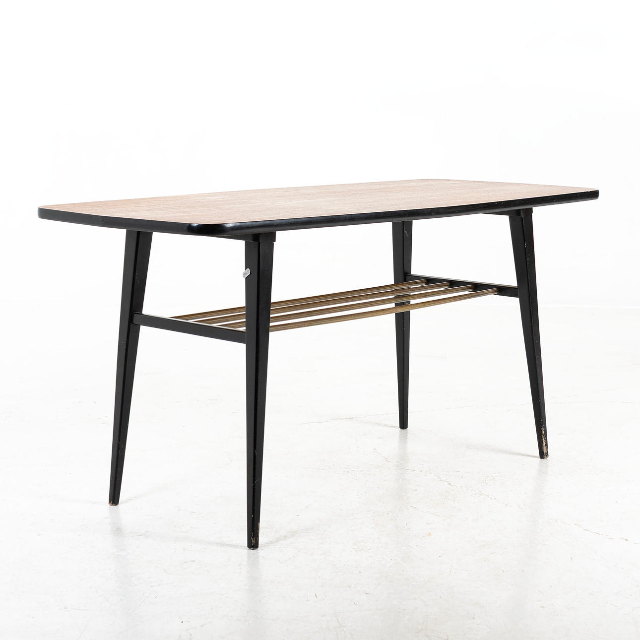 A teak coffee table with blackened legs, 1960s.