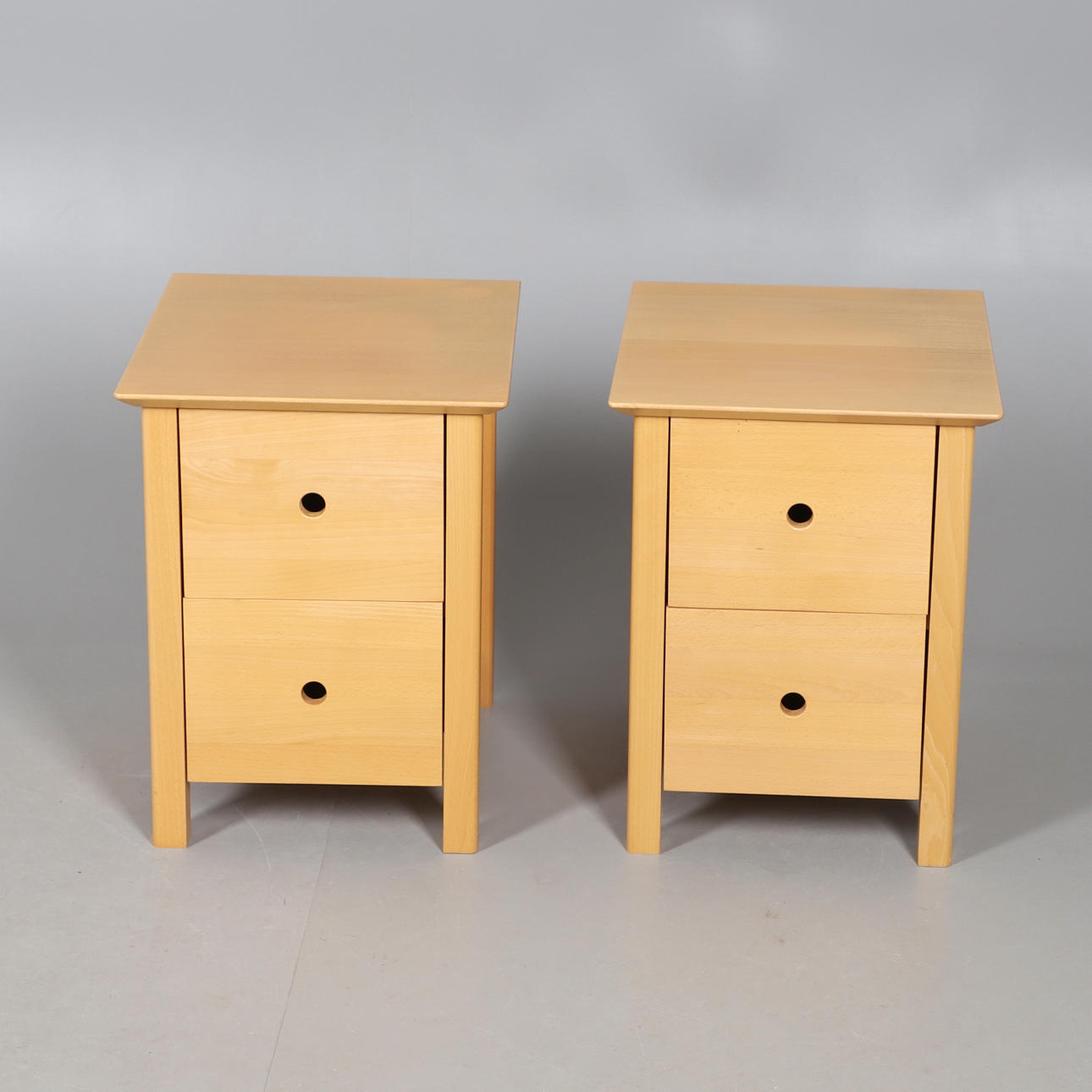 TWO BEECH FINISH BEDSIDE CHESTS OF DRAWERS.