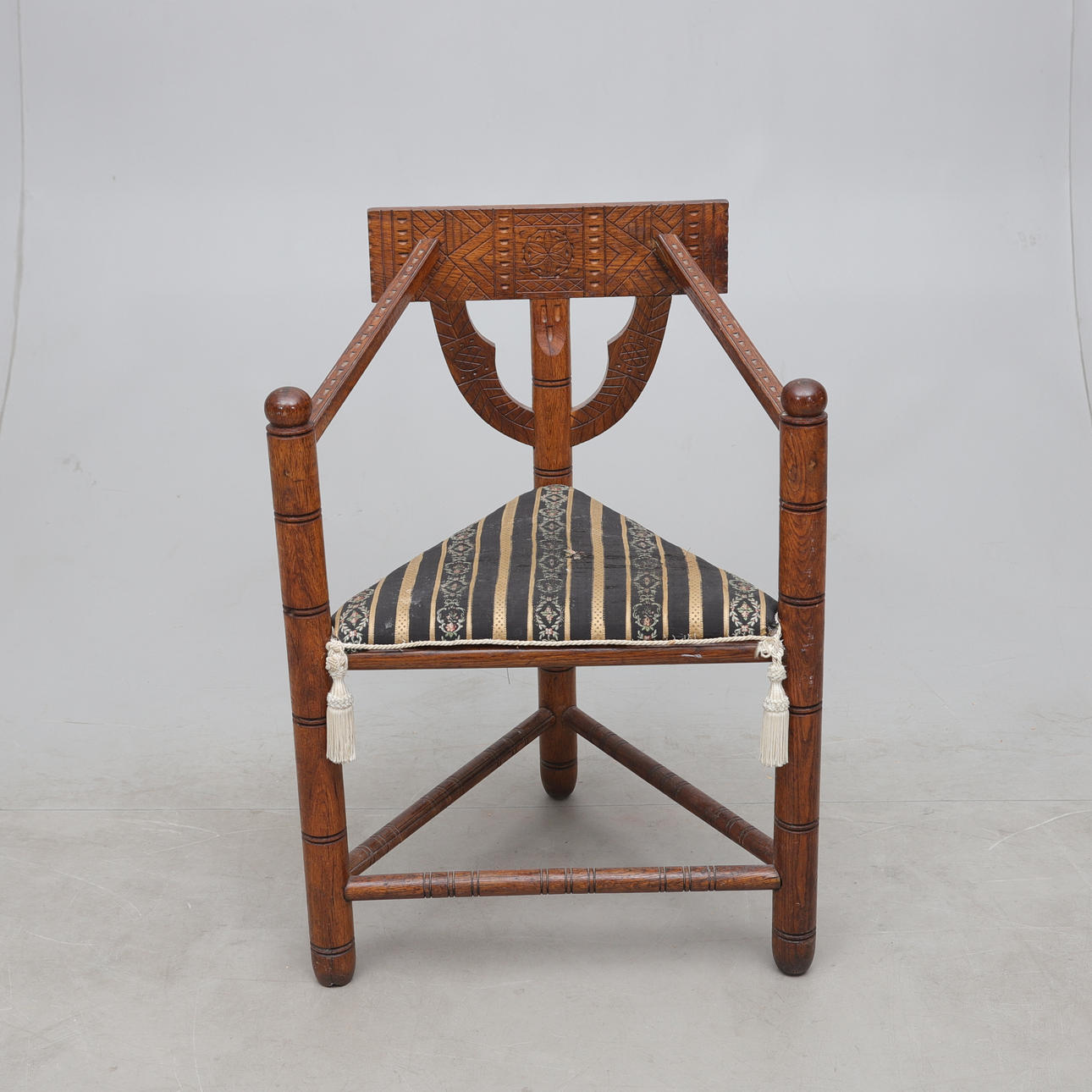 A monk's chair, circa 1900.