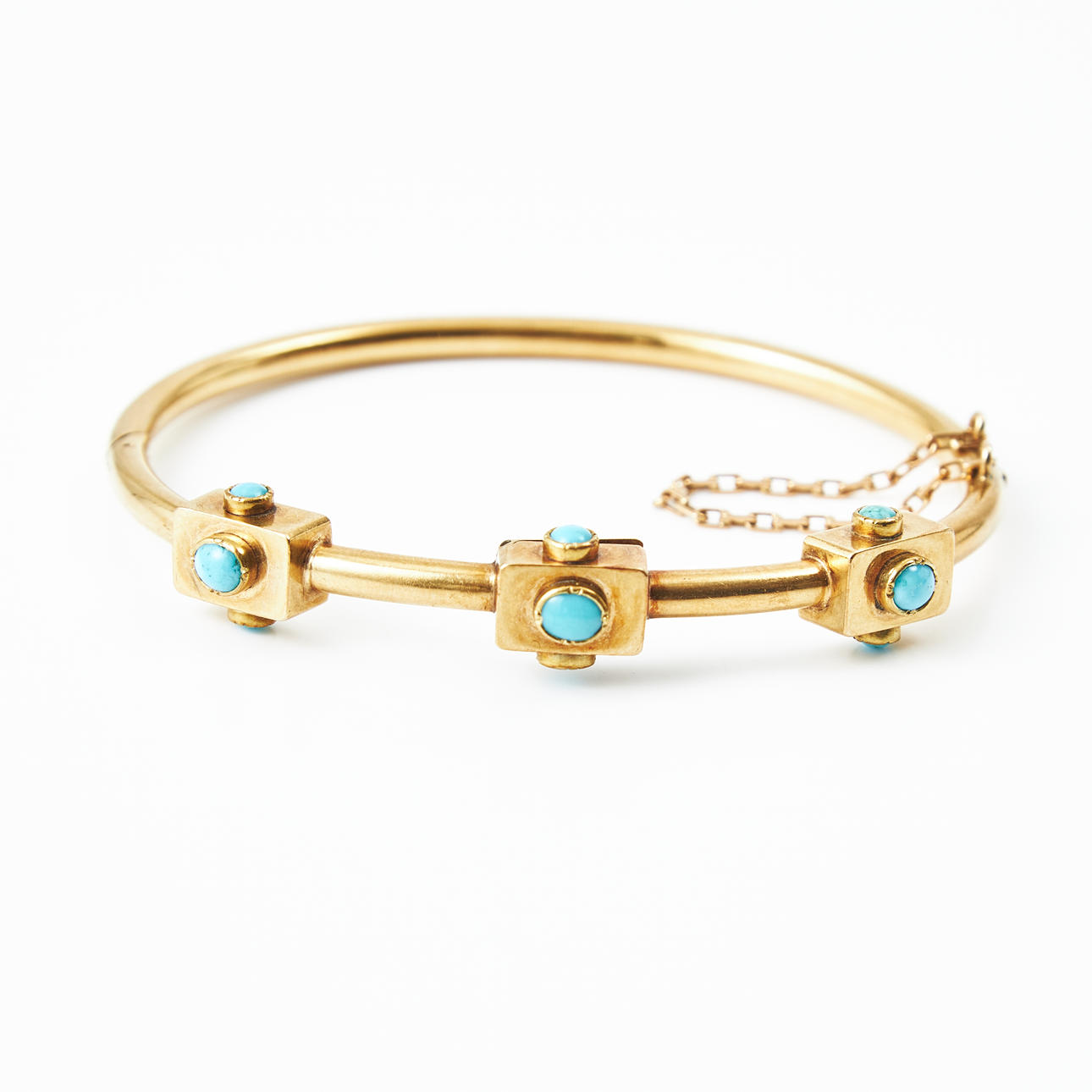 A bangle, 18k gold, turquoise imitations, decorative part in the middle with openable hide at the bottom, Gustaf Möllenborg, Stockholm 1840.