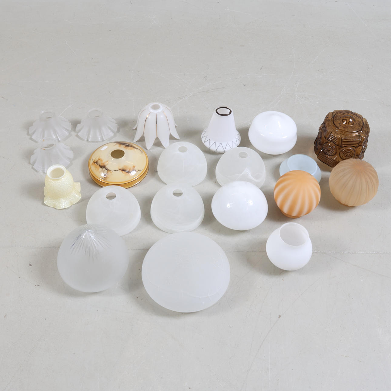A set of about 20 lamp cups, first half of the 20th century.