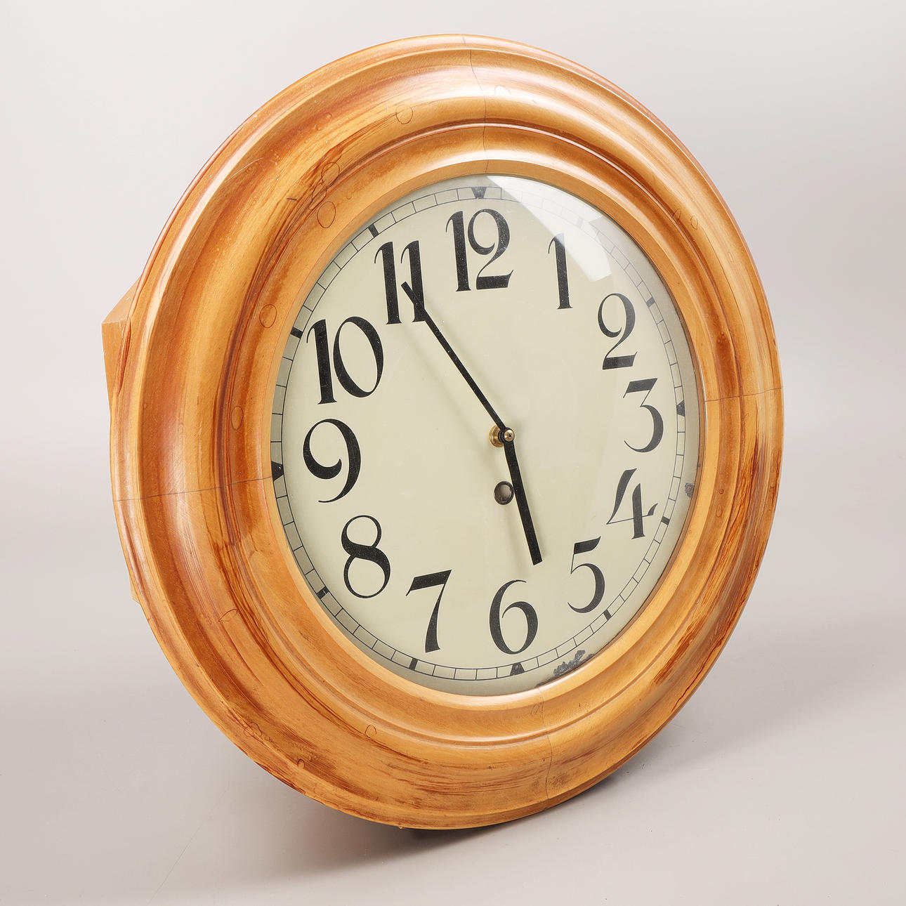 A wall clock, diameter 48 cm, first half of the 20th century.